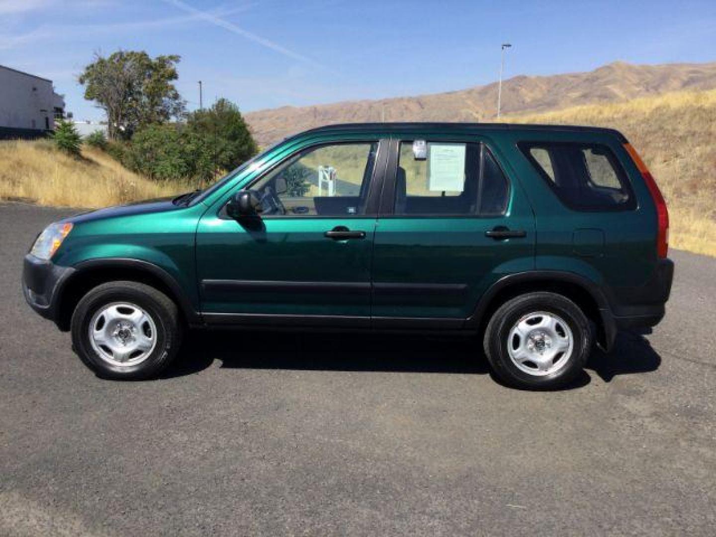 2002 Clover Green Pearl /Saddle Cloth Interior Honda CR-V LX 2WD (JHLRD68422C) with an 2.4L L4 DOHC 16V engine, 4-Speed Automatic transmission, located at 1801 Main Street, Lewiston, 83501, (208) 743-9371, 46.417065, -117.004799 - Photo#1