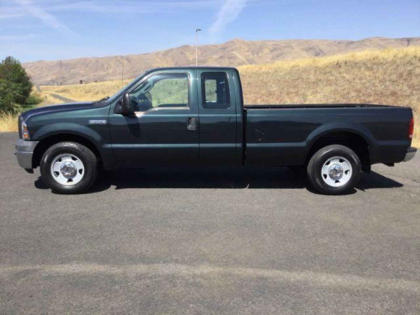 2006 Dark Stone Metallic /Medium Flint Vinyl Interior Ford F-250 SD XL SuperCab Long Bed 2WD (1FTSX20566E) with an 5.4L V8 SOHC 16V engine, 6-Speed Manual transmission, located at 1801 Main Street, Lewiston, 83501, (208) 743-9371, 46.417065, -117.004799 - Photo#1