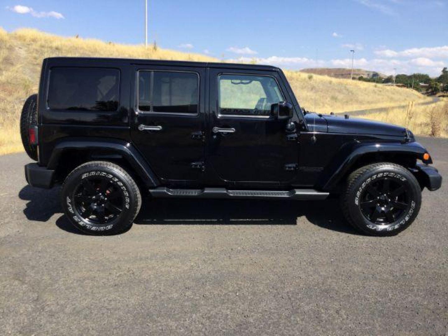 2014 Black Clearcoat /Black Jeep Wrangler Unlimited Sahara 4WD (1C4BJWEG7EL) with an 3.6L V6 DOHC 24V FFV engine, 5-Speed Automatic transmission, located at 1801 Main Street, Lewiston, 83501, (208) 743-9371, 46.417065, -117.004799 - Photo#16