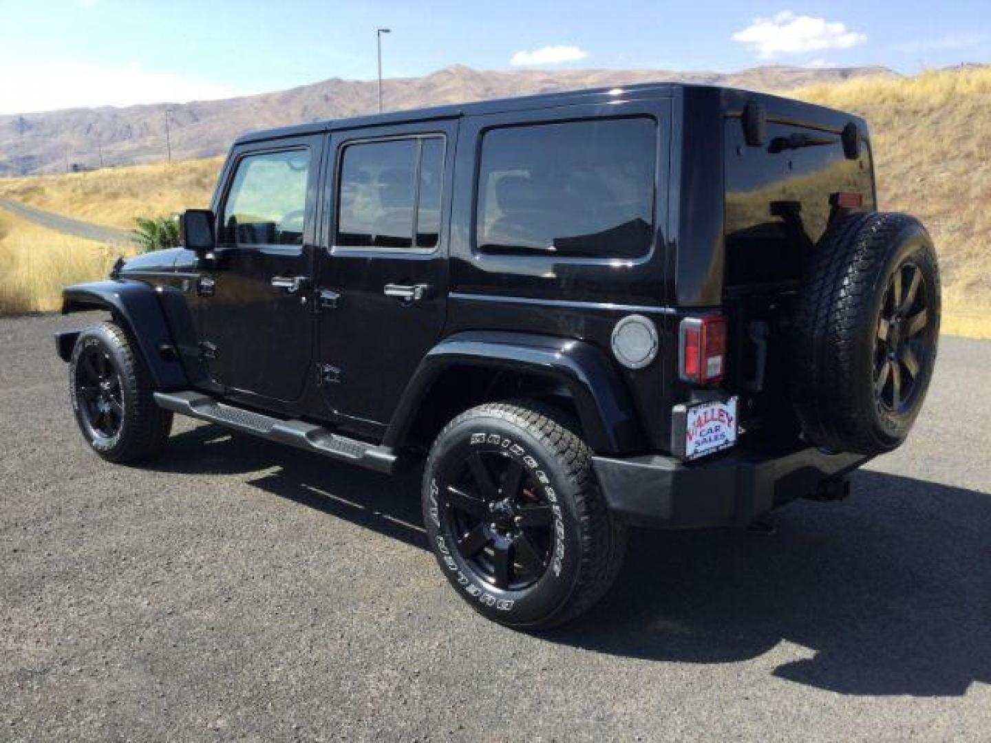 2014 Black Clearcoat /Black Jeep Wrangler Unlimited Sahara 4WD (1C4BJWEG7EL) with an 3.6L V6 DOHC 24V FFV engine, 5-Speed Automatic transmission, located at 1801 Main Street, Lewiston, 83501, (208) 743-9371, 46.417065, -117.004799 - Photo#2