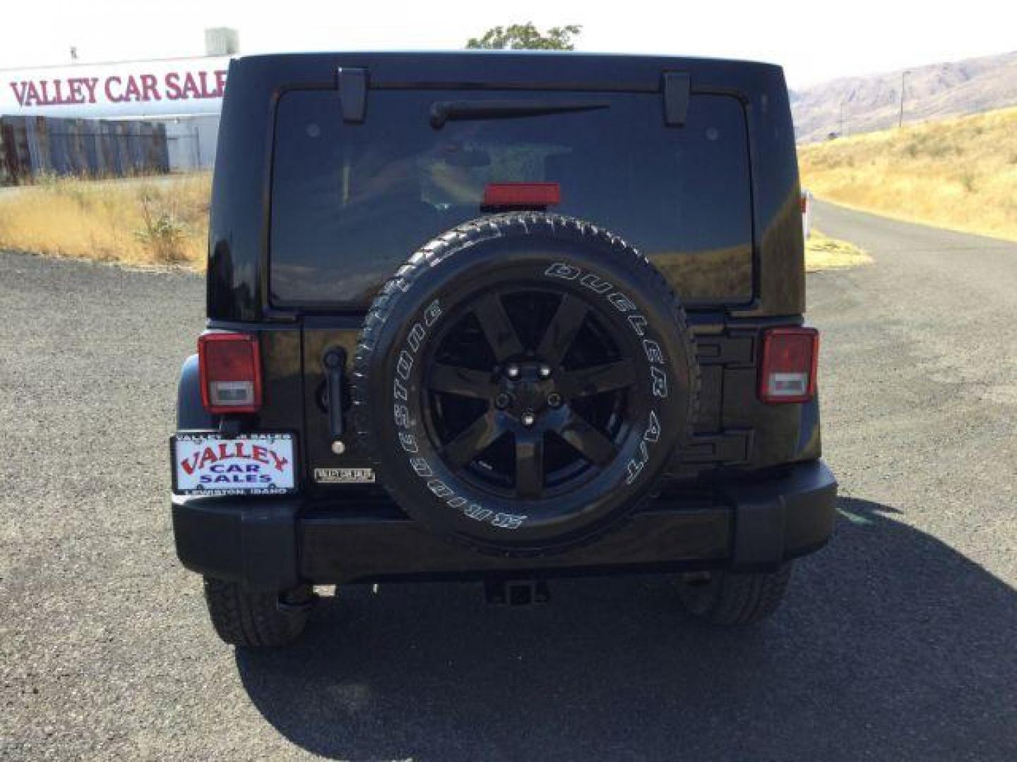 2014 Black Clearcoat /Black Jeep Wrangler Unlimited Sahara 4WD (1C4BJWEG7EL) with an 3.6L V6 DOHC 24V FFV engine, 5-Speed Automatic transmission, located at 1801 Main Street, Lewiston, 83501, (208) 743-9371, 46.417065, -117.004799 - Photo#7