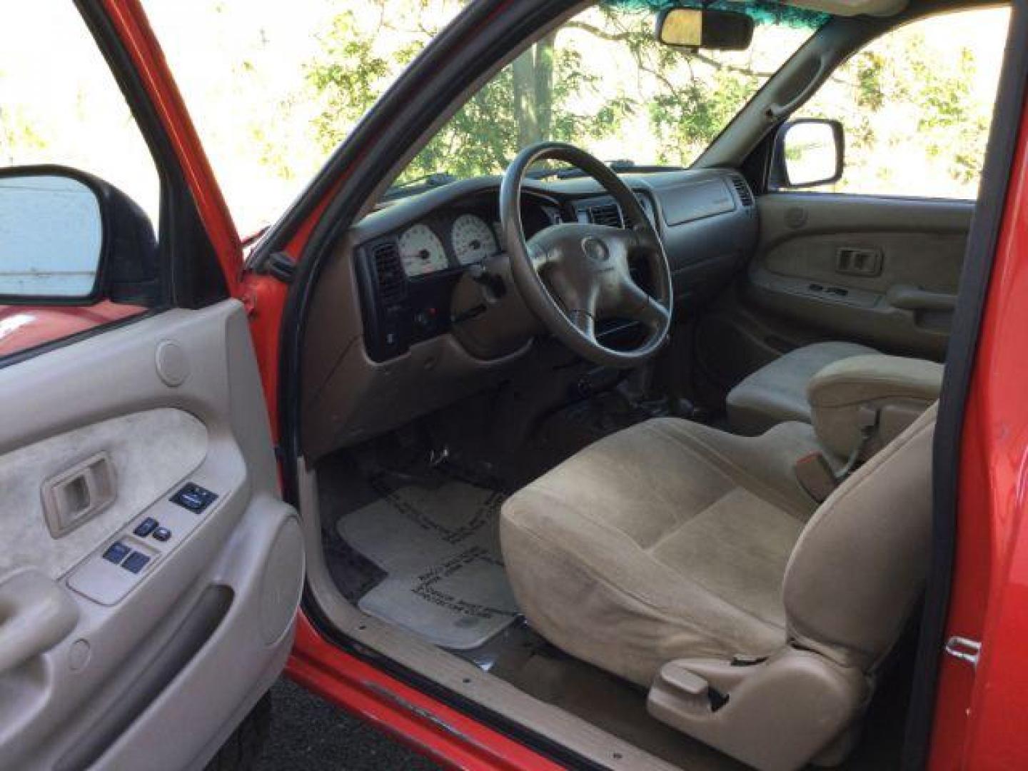 2001 Impulse Red /Oak Cloth Toyota Tacoma Xtracab V6 4WD (5TEWN72N11Z) with an 3.4L V6 DOHC 24V engine, 5-Speed Manual transmission, located at 1801 Main Street, Lewiston, 83501, (208) 743-9371, 46.417065, -117.004799 - Photo#3