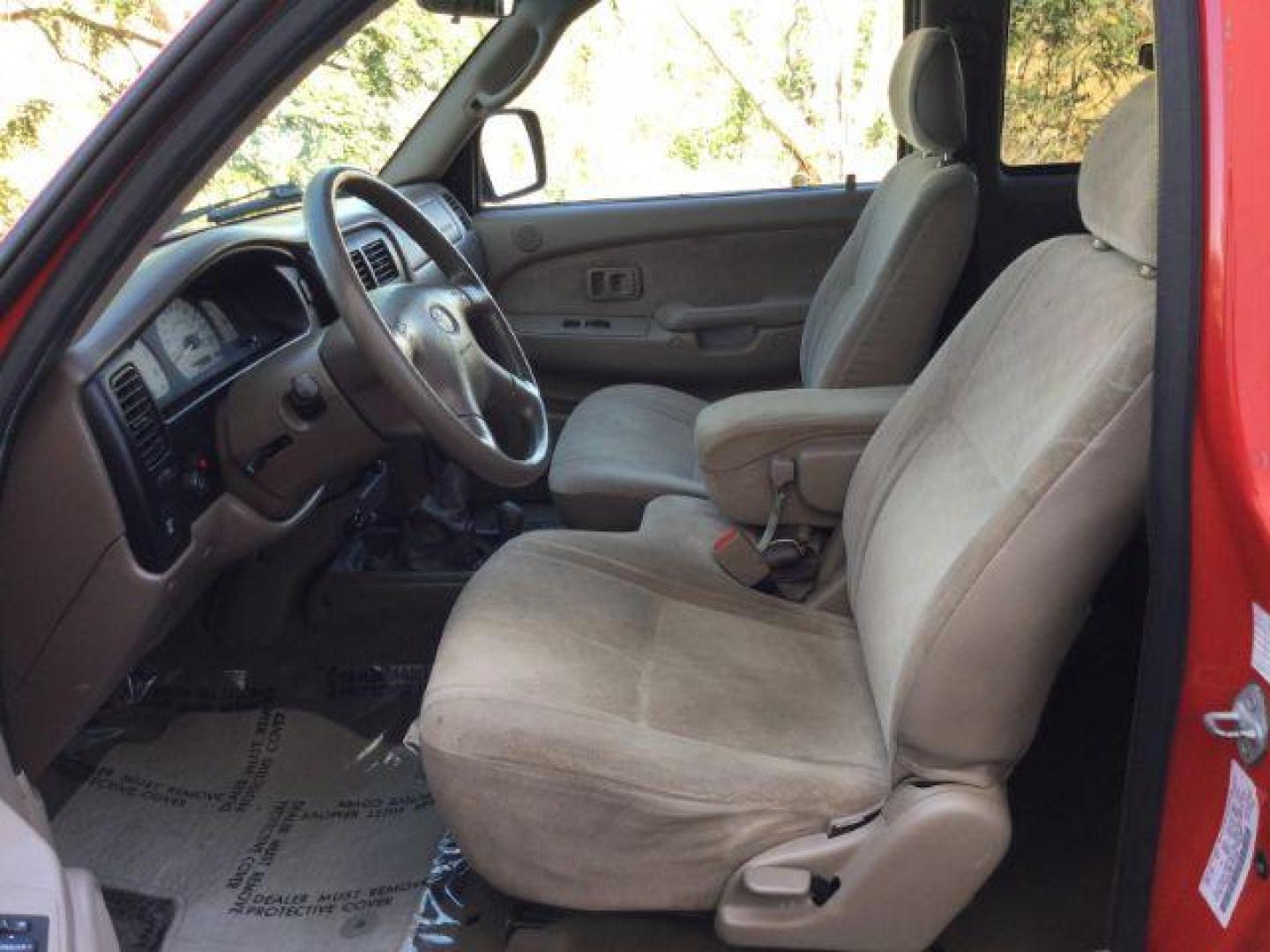 2001 Impulse Red /Oak Cloth Toyota Tacoma Xtracab V6 4WD (5TEWN72N11Z) with an 3.4L V6 DOHC 24V engine, 5-Speed Manual transmission, located at 1801 Main Street, Lewiston, 83501, (208) 743-9371, 46.417065, -117.004799 - Photo#4