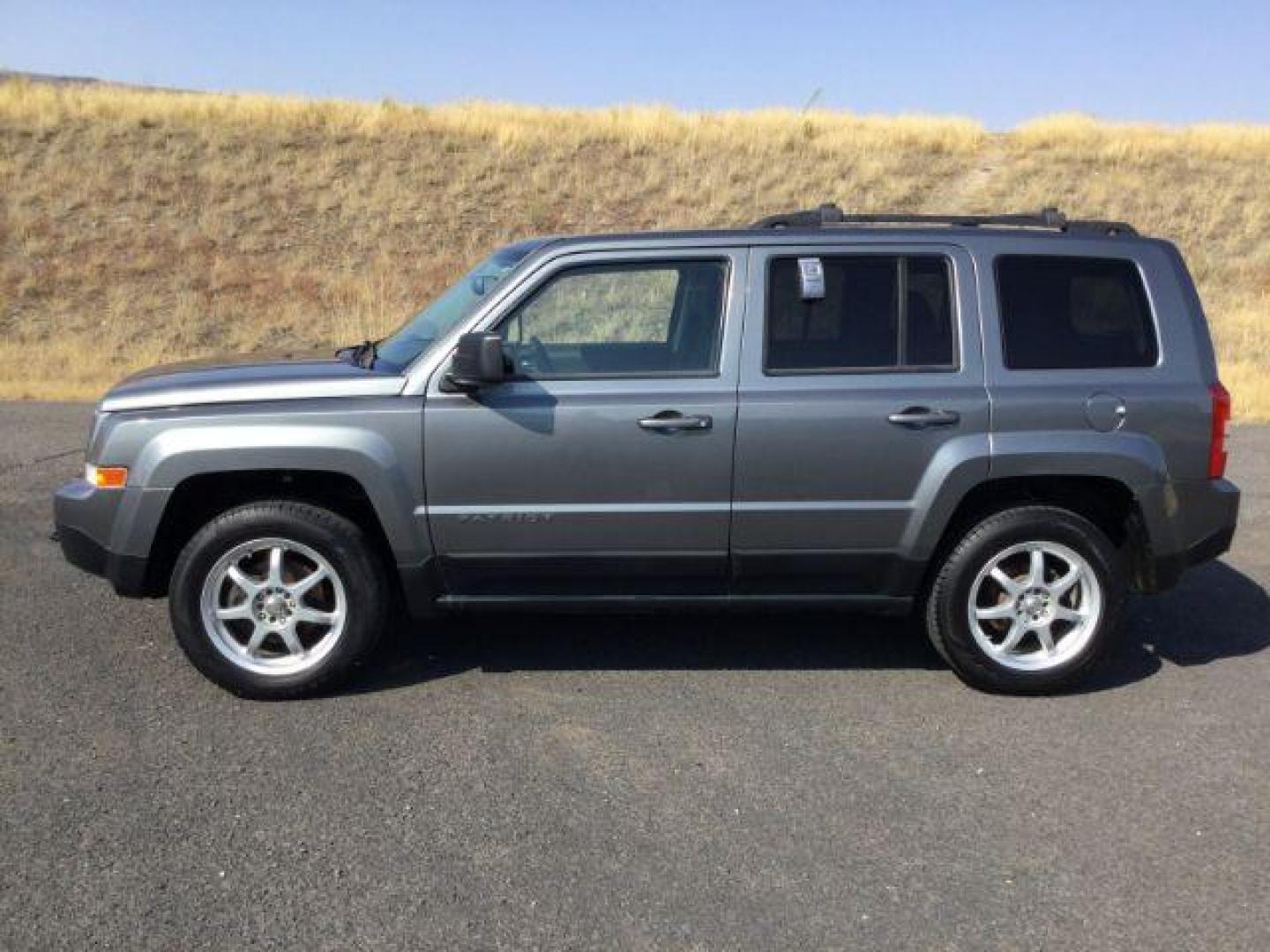 2011 Mineral Gray Metallic /Dark Slate Gray Cloth Interior Jeep Patriot 4WD (1J4NF1GB8BD) with an 2.4L L4 DOHC 16V engine, Continuously Variable Transmission transmission, located at 1801 Main Street, Lewiston, 83501, (208) 743-9371, 46.417065, -117.004799 - Photo#1