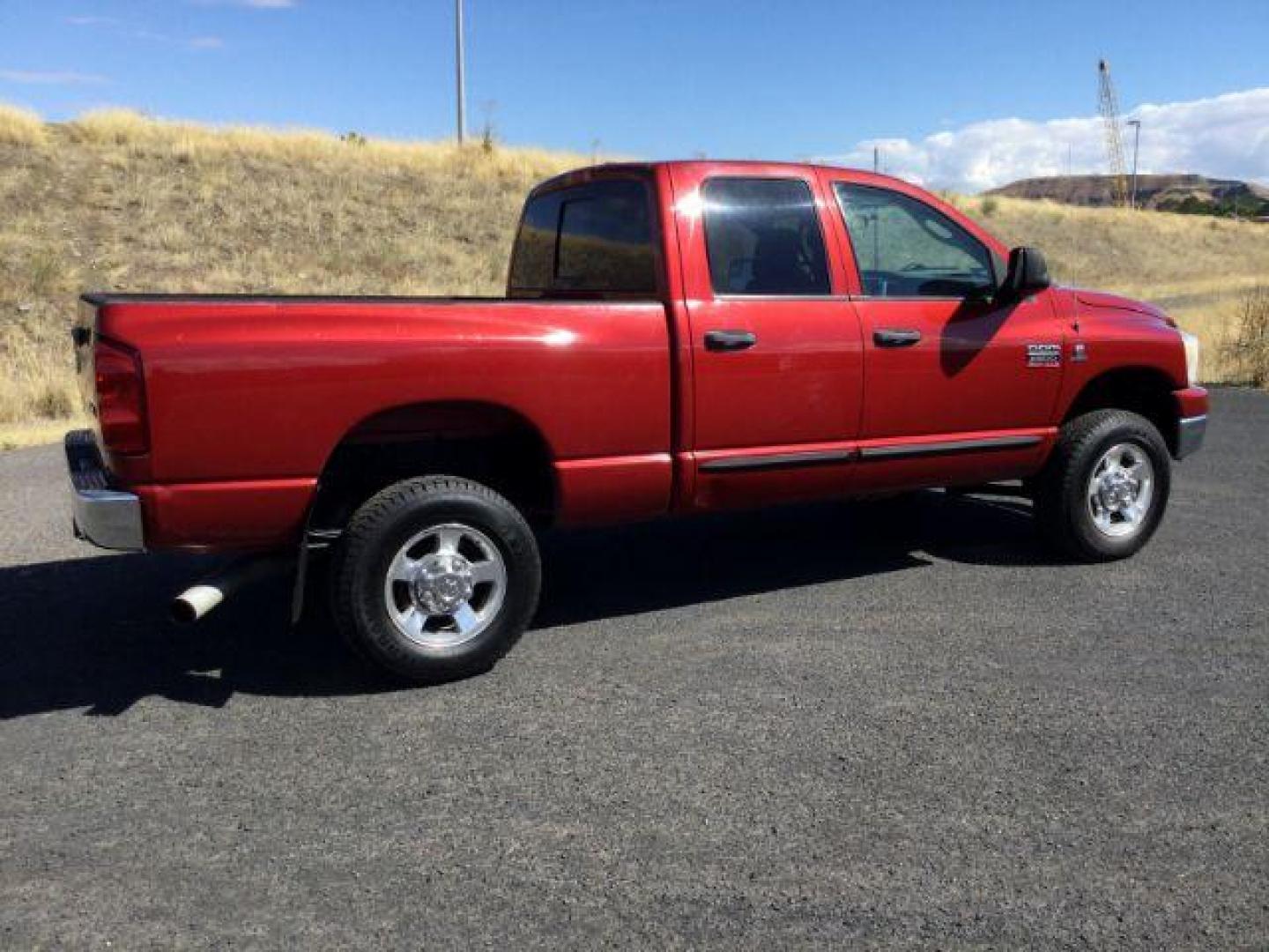 2007 Inferno Red Crystal Pearl Coat /Medium Slate Gray Cloth Interior Dodge Ram 2500 SLT Quad Cab 4WD (3D7KS28A37G) with an 6.7L L6 OHV 24V TURBO DIESEL engine, 6-Speed Manual transmission, located at 1801 Main Street, Lewiston, 83501, (208) 743-9371, 46.417065, -117.004799 - Photo#10