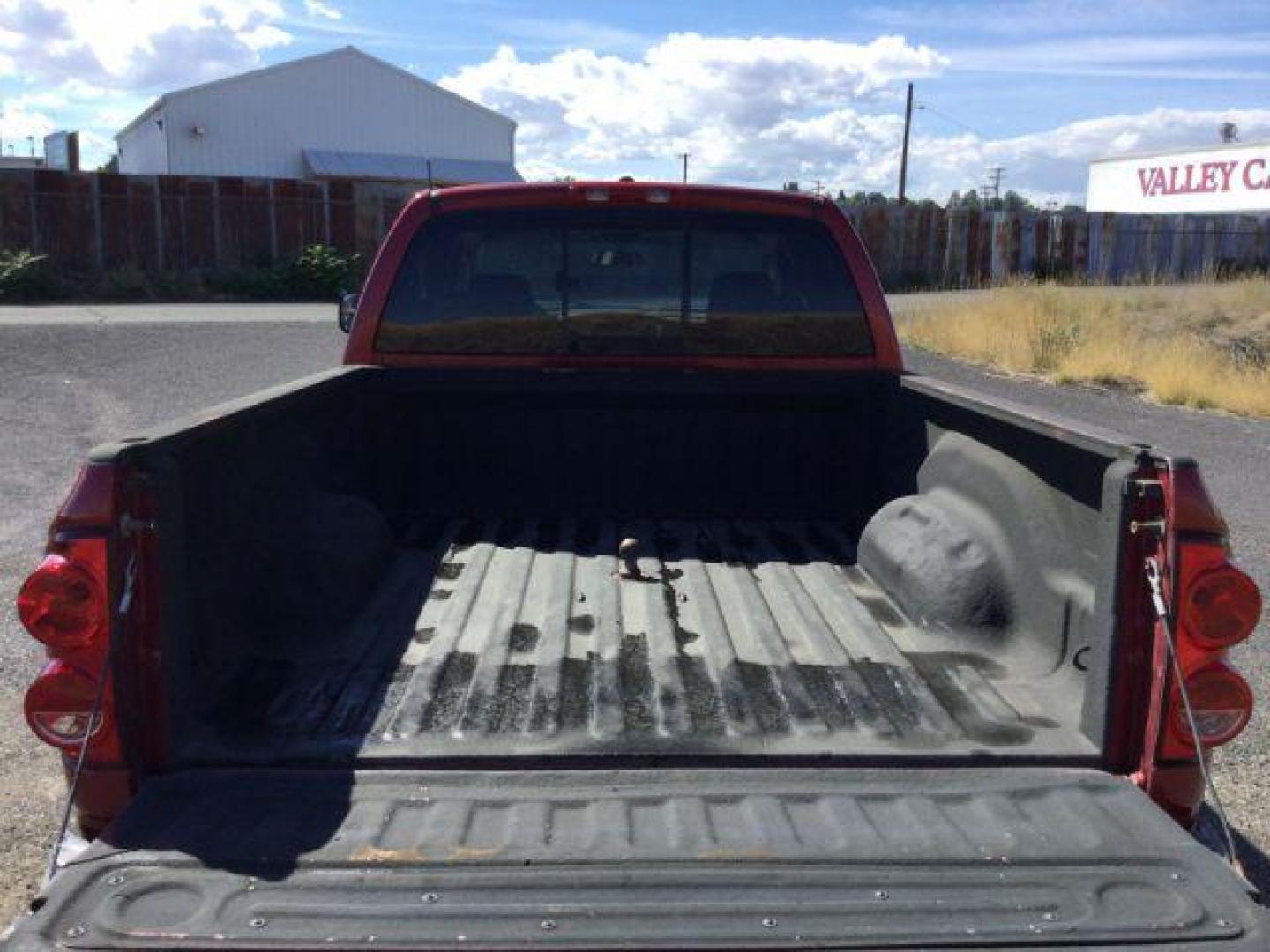 2007 Inferno Red Crystal Pearl Coat /Medium Slate Gray Cloth Interior Dodge Ram 2500 SLT Quad Cab 4WD (3D7KS28A37G) with an 6.7L L6 OHV 24V TURBO DIESEL engine, 6-Speed Manual transmission, located at 1801 Main Street, Lewiston, 83501, (208) 743-9371, 46.417065, -117.004799 - Photo#11