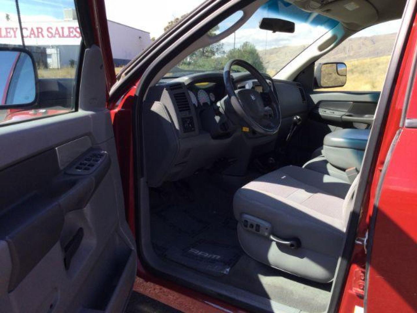 2007 Inferno Red Crystal Pearl Coat /Medium Slate Gray Cloth Interior Dodge Ram 2500 SLT Quad Cab 4WD (3D7KS28A37G) with an 6.7L L6 OHV 24V TURBO DIESEL engine, 6-Speed Manual transmission, located at 1801 Main Street, Lewiston, 83501, (208) 743-9371, 46.417065, -117.004799 - Photo#14