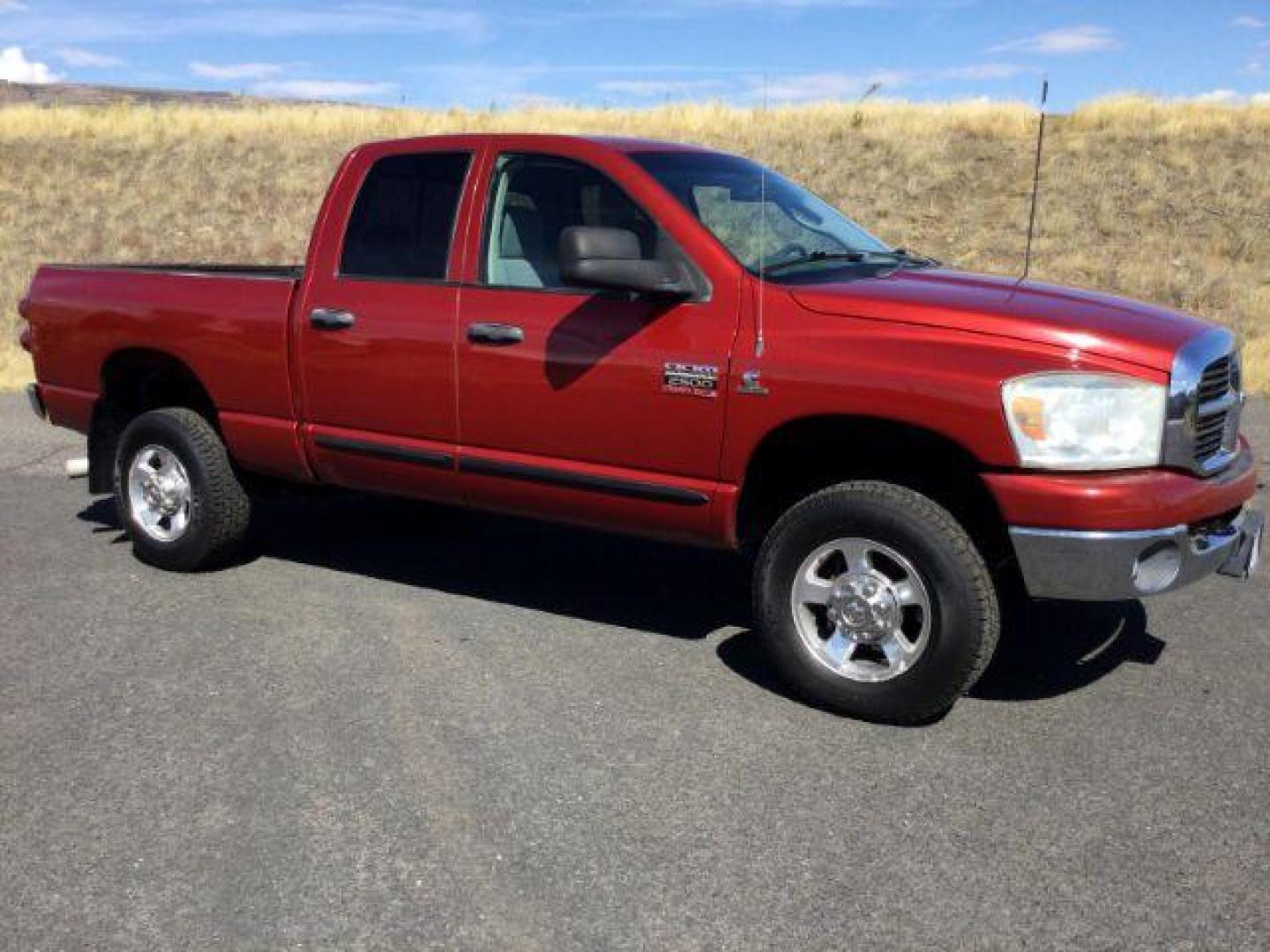 2007 Inferno Red Crystal Pearl Coat /Medium Slate Gray Cloth Interior Dodge Ram 2500 SLT Quad Cab 4WD (3D7KS28A37G) with an 6.7L L6 OHV 24V TURBO DIESEL engine, 6-Speed Manual transmission, located at 1801 Main Street, Lewiston, 83501, (208) 743-9371, 46.417065, -117.004799 - Photo#8