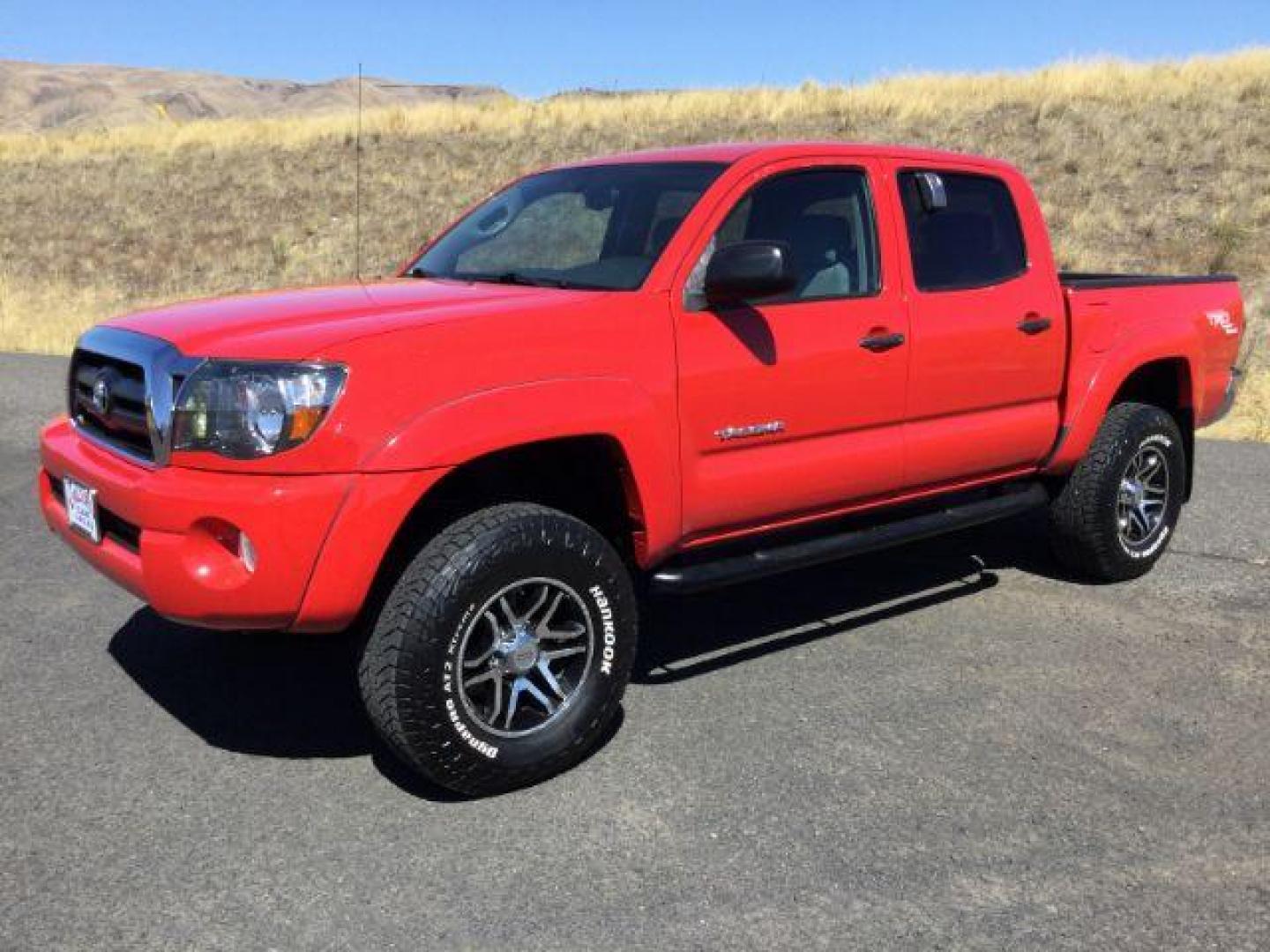 2006 Radiant Red /Graphite Cloth Interior Toyota Tacoma Double Cab V6 4WD (5TELU42N76Z) with an 4.0L V6 DOHC 24V engine, automatic transmission, located at 1801 Main Street, Lewiston, 83501, (208) 743-9371, 46.417065, -117.004799 - Photo#0