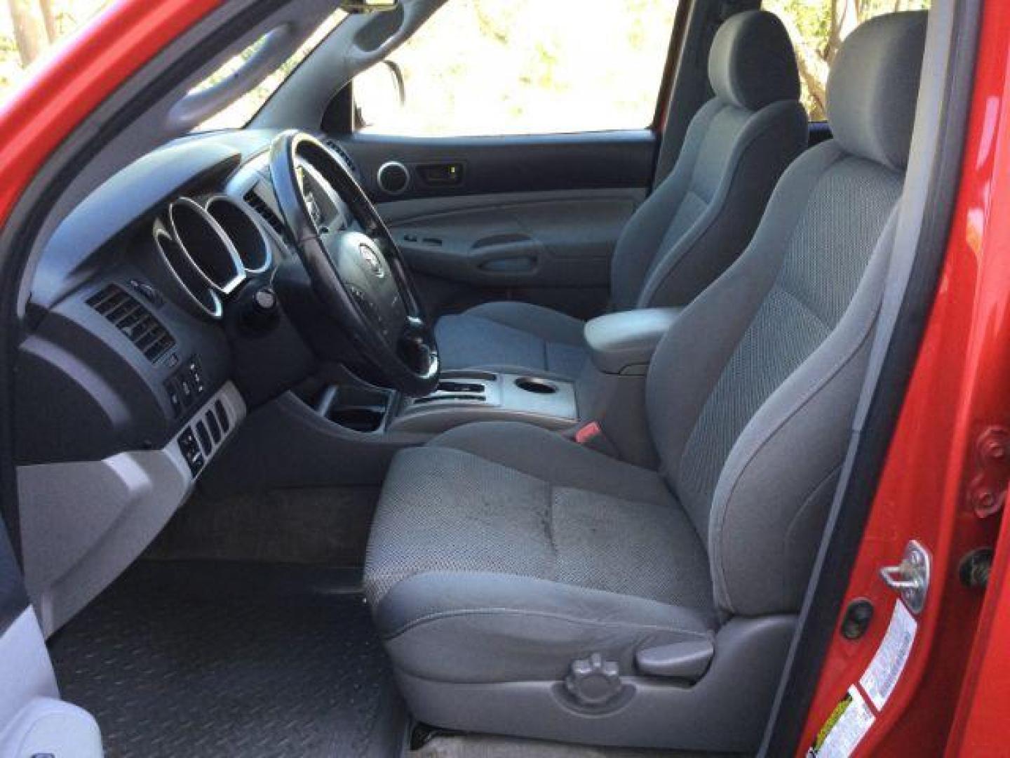 2006 Radiant Red /Graphite Cloth Interior Toyota Tacoma Double Cab V6 4WD (5TELU42N76Z) with an 4.0L V6 DOHC 24V engine, automatic transmission, located at 1801 Main Street, Lewiston, 83501, (208) 743-9371, 46.417065, -117.004799 - Photo#3