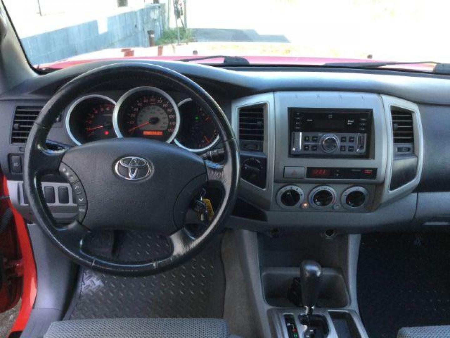 2006 Radiant Red /Graphite Cloth Interior Toyota Tacoma Double Cab V6 4WD (5TELU42N76Z) with an 4.0L V6 DOHC 24V engine, automatic transmission, located at 1801 Main Street, Lewiston, 83501, (208) 743-9371, 46.417065, -117.004799 - Photo#5