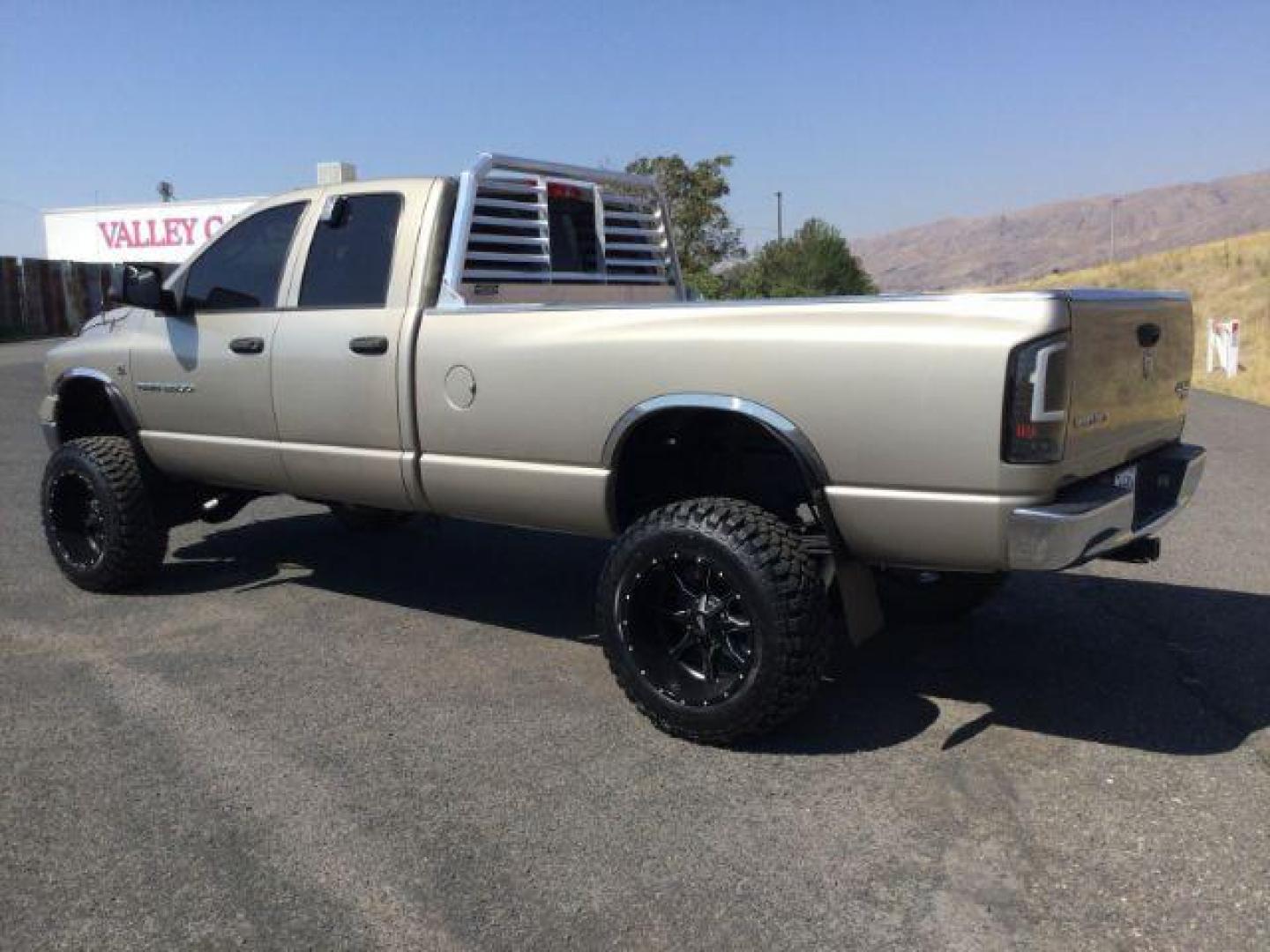 2005 Light Almond Pearl Metallic /Taupe Cloth Interior Dodge Ram 3500 SLT Quad Cab Long Bed 4WD (3D7LS38C25G) with an 5.9L L6 OHV 24V TURBO DIESEL engine, 6-Speed Manual transmission, located at 1801 Main Street, Lewiston, 83501, (208) 743-9371, 46.417065, -117.004799 - Photo#2