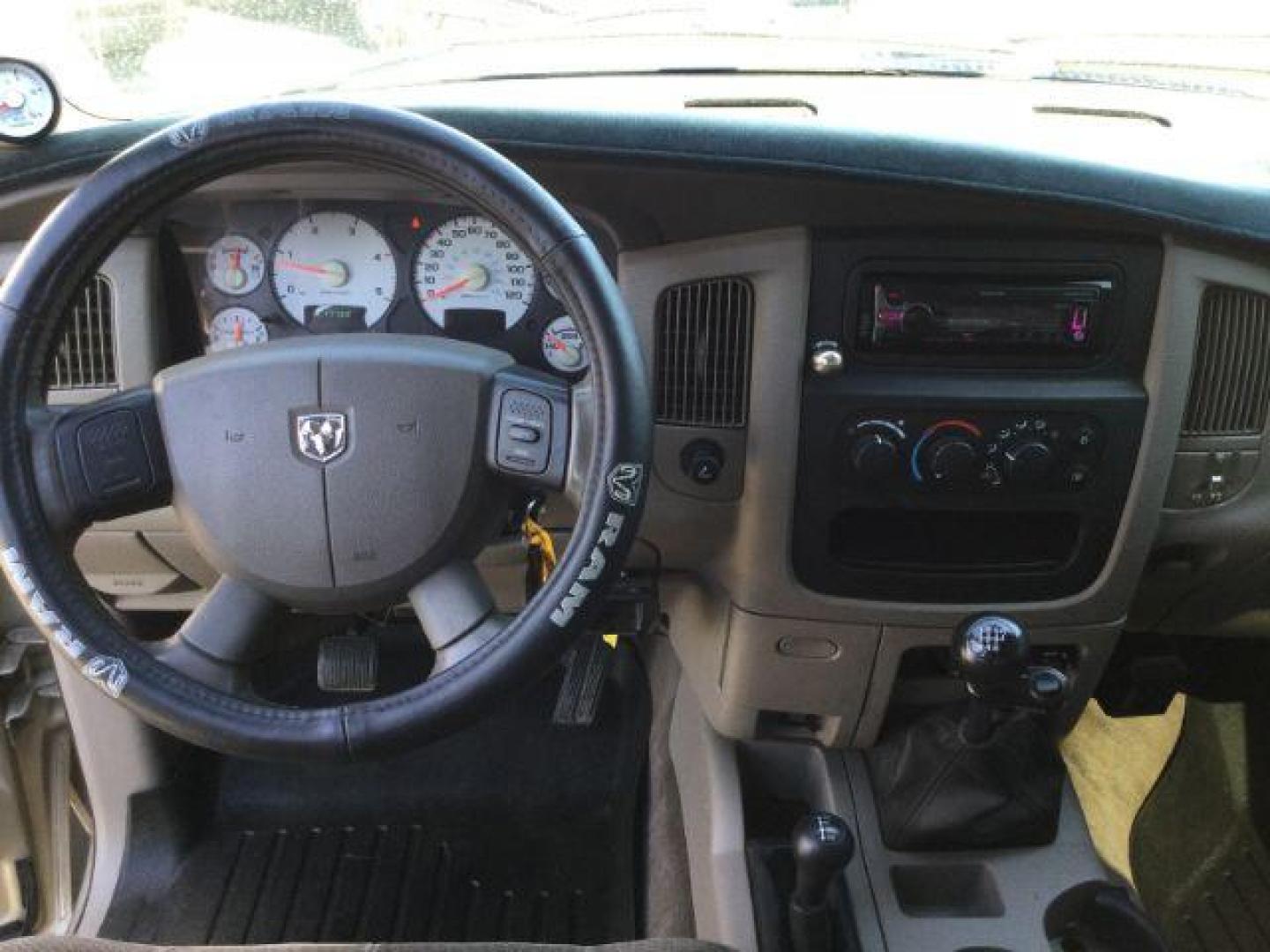 2005 Light Almond Pearl Metallic /Taupe Cloth Interior Dodge Ram 3500 SLT Quad Cab Long Bed 4WD (3D7LS38C25G) with an 5.9L L6 OHV 24V TURBO DIESEL engine, 6-Speed Manual transmission, located at 1801 Main Street, Lewiston, 83501, (208) 743-9371, 46.417065, -117.004799 - Photo#8