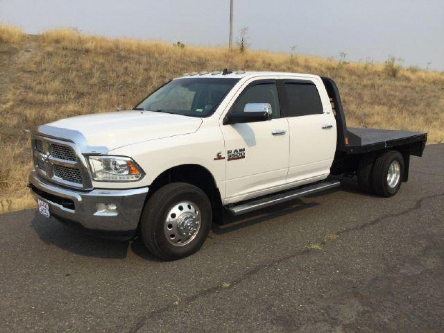 2014 WHITE /black leather RAM 3500 Crew Cab 4WD DRW (3C7WRTCLXEG) with an 6.7L L6 OHV 24V TURBO DIESEL engine, 6-Speed Automatic transmission, located at 1801 Main Street, Lewiston, 83501, (208) 743-9371, 46.417065, -117.004799 - Photo#0