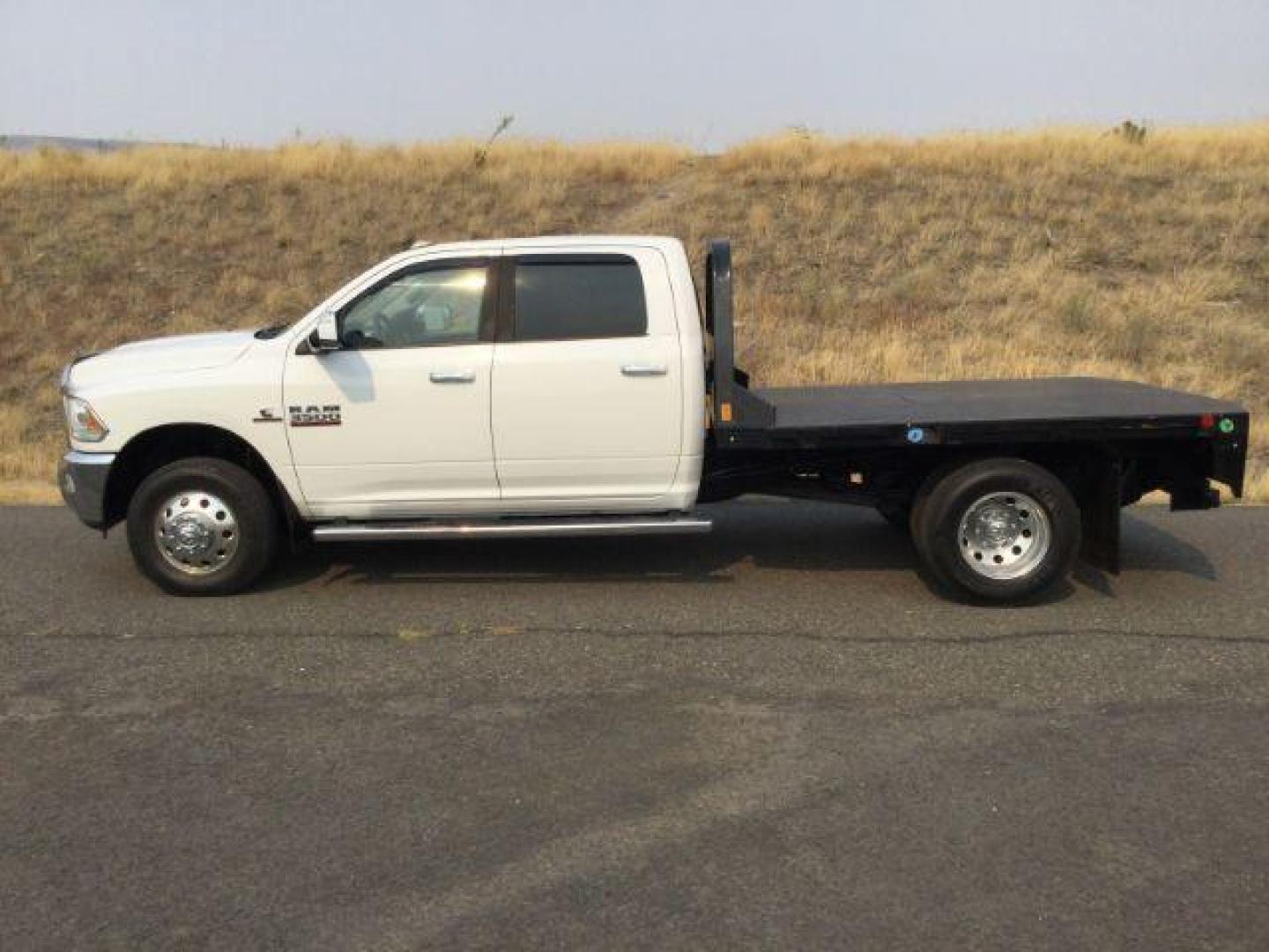 2014 WHITE /black leather RAM 3500 Crew Cab 4WD DRW (3C7WRTCLXEG) with an 6.7L L6 OHV 24V TURBO DIESEL engine, 6-Speed Automatic transmission, located at 1801 Main Street, Lewiston, 83501, (208) 743-9371, 46.417065, -117.004799 - Photo#1