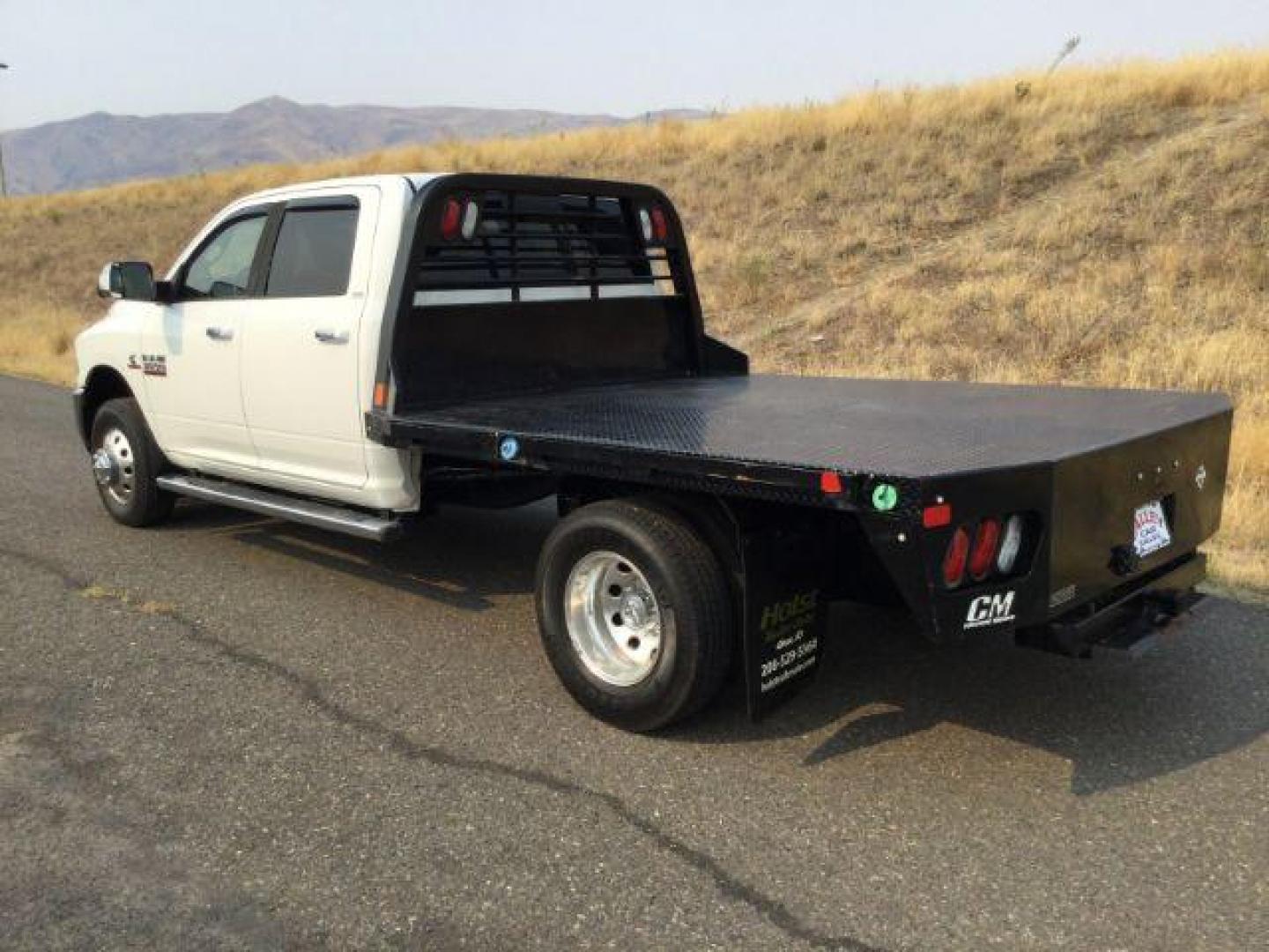 2014 WHITE /black leather RAM 3500 Crew Cab 4WD DRW (3C7WRTCLXEG) with an 6.7L L6 OHV 24V TURBO DIESEL engine, 6-Speed Automatic transmission, located at 1801 Main Street, Lewiston, 83501, (208) 743-9371, 46.417065, -117.004799 - Photo#2