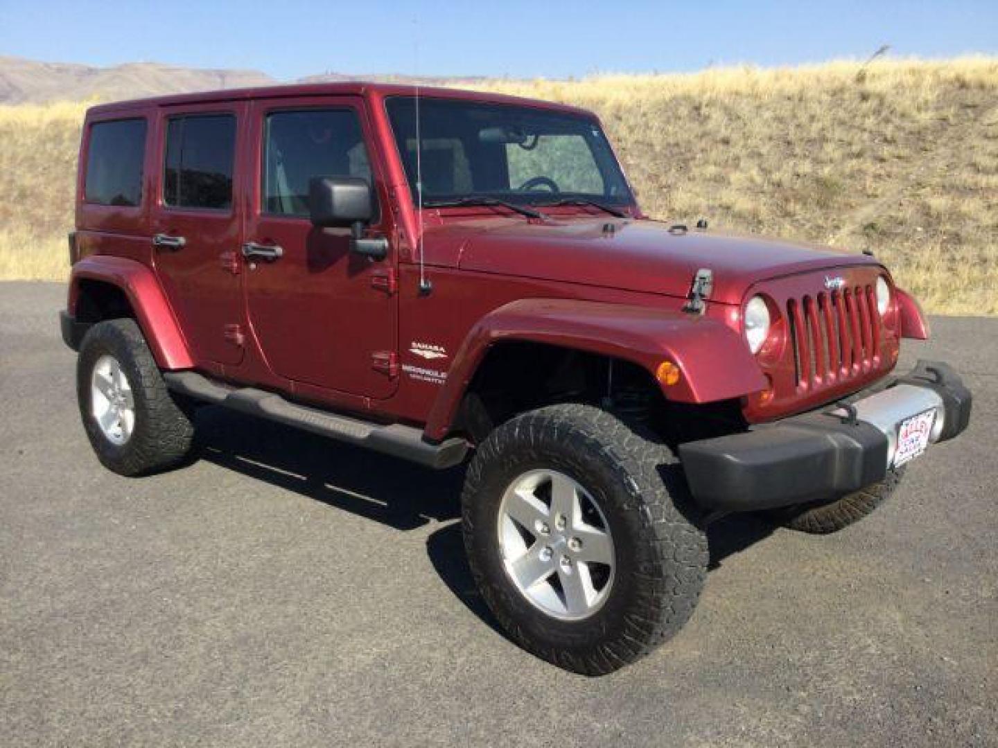 2011 Deep Cherry Red Crystal Pearl /Black Cloth Interior Jeep Wrangler Unlimited Sahara 4WD (1J4BA5H18BL) with an 3.8L V6 OHV 12V engine, 4-Speed Automatic transmission, located at 1801 Main Street, Lewiston, 83501, (208) 743-9371, 46.417065, -117.004799 - Photo#9