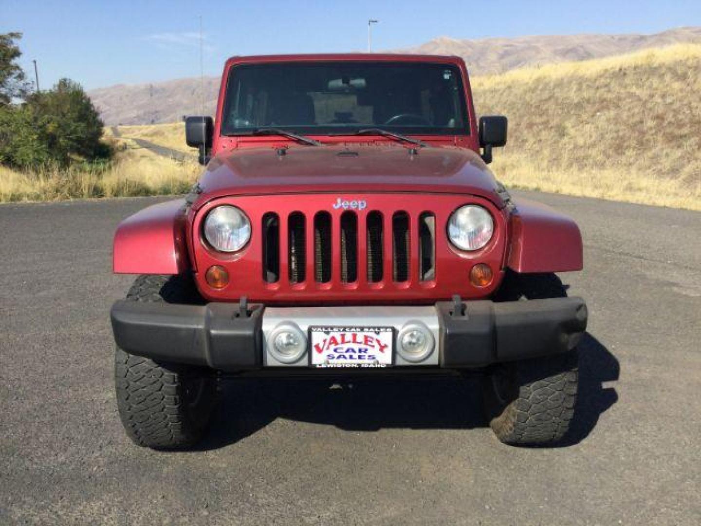 2011 Deep Cherry Red Crystal Pearl /Black Cloth Interior Jeep Wrangler Unlimited Sahara 4WD (1J4BA5H18BL) with an 3.8L V6 OHV 12V engine, 4-Speed Automatic transmission, located at 1801 Main Street, Lewiston, 83501, (208) 743-9371, 46.417065, -117.004799 - Photo#6