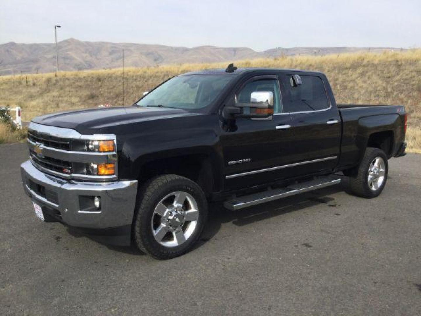 2018 Black /Jet Black, leather Chevrolet Silverado 2500HD LTZ Crew Cab 4WD (1GC1KWEG9JF) with an 6.0L V8 OHV 16V FFV engine, 6-Speed Automatic transmission, located at 1801 Main Street, Lewiston, 83501, (208) 743-9371, 46.417065, -117.004799 - Photo#0