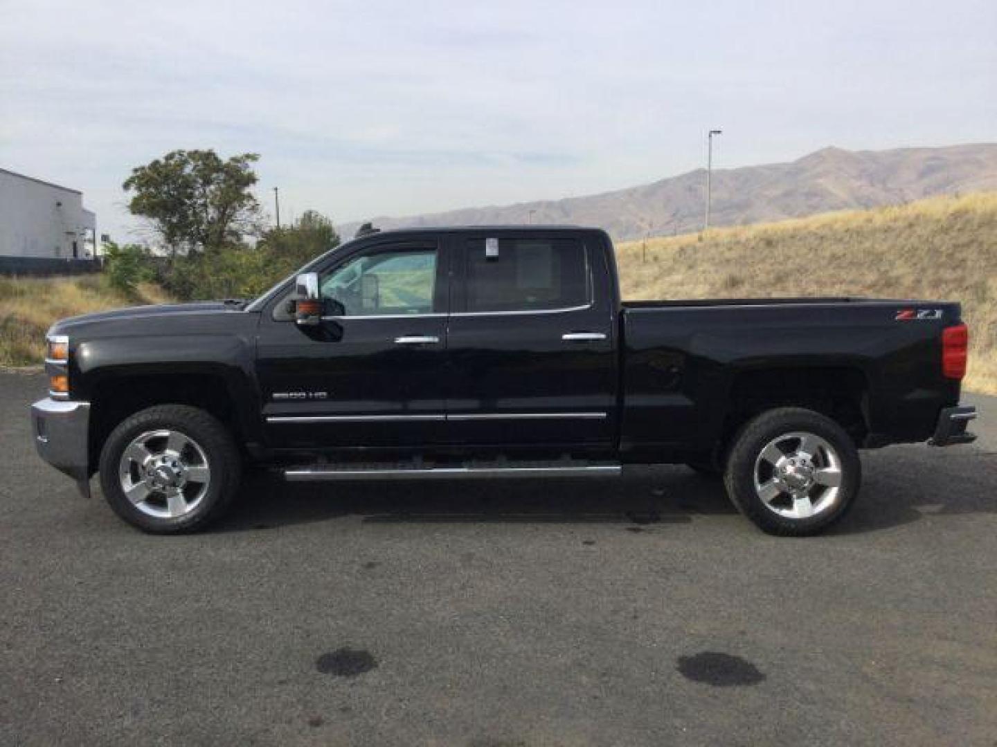 2018 Black /Jet Black, leather Chevrolet Silverado 2500HD LTZ Crew Cab 4WD (1GC1KWEG9JF) with an 6.0L V8 OHV 16V FFV engine, 6-Speed Automatic transmission, located at 1801 Main Street, Lewiston, 83501, (208) 743-9371, 46.417065, -117.004799 - Photo#1