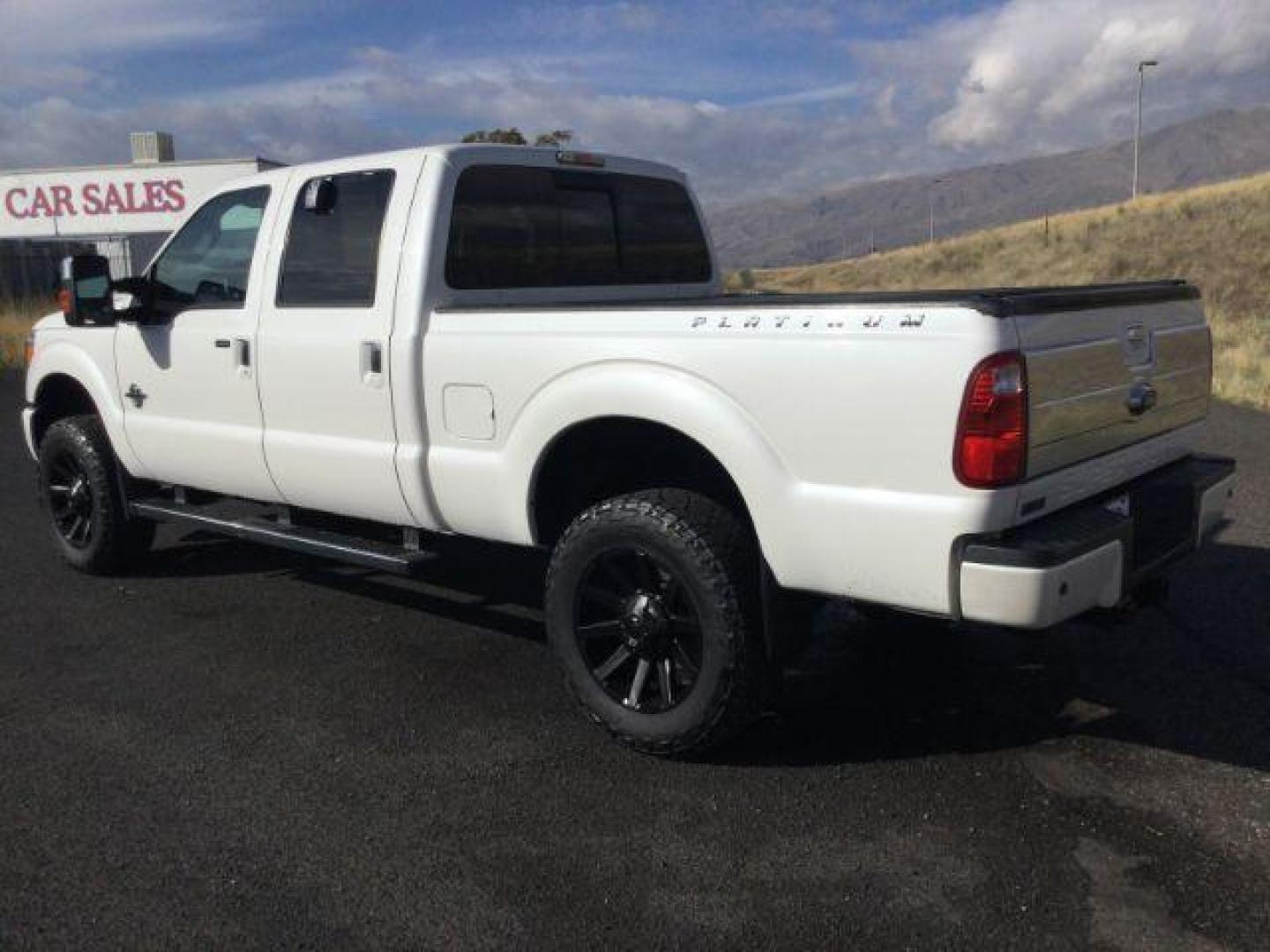 2014 White Platinum Met TC /Black Ford F-350 SD Lariat Crew Cab 4WD (1FT8W3BT9EE) with an 6.7L V8 OHV 16V DIESEL engine, 6-Speed Automatic transmission, located at 1801 Main Street, Lewiston, 83501, (208) 743-9371, 46.417065, -117.004799 - Photo#2