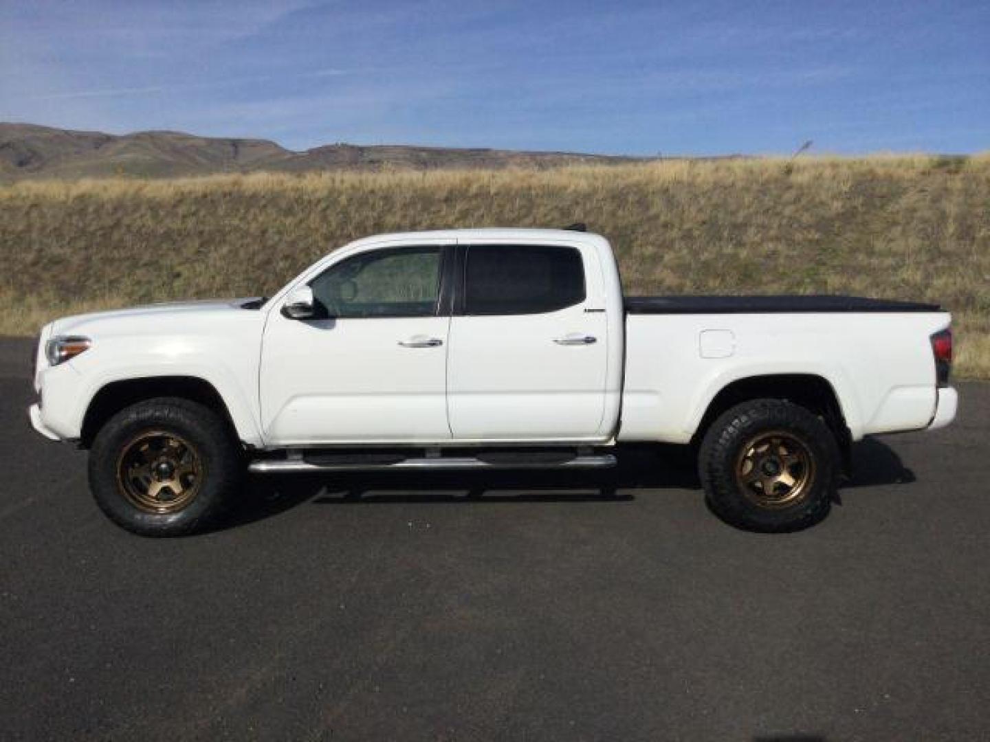 2016 Super White /Hickory, leather Toyota Tacoma Limited Double Cab Super Long Bed V6 5AT 4WD (5TFHZ5BN2GX) with an 3.5L V6 DOHC 24V engine, 6-Speed Automatic transmission, located at 1801 Main Street, Lewiston, 83501, (208) 743-9371, 46.417065, -117.004799 - Photo#1