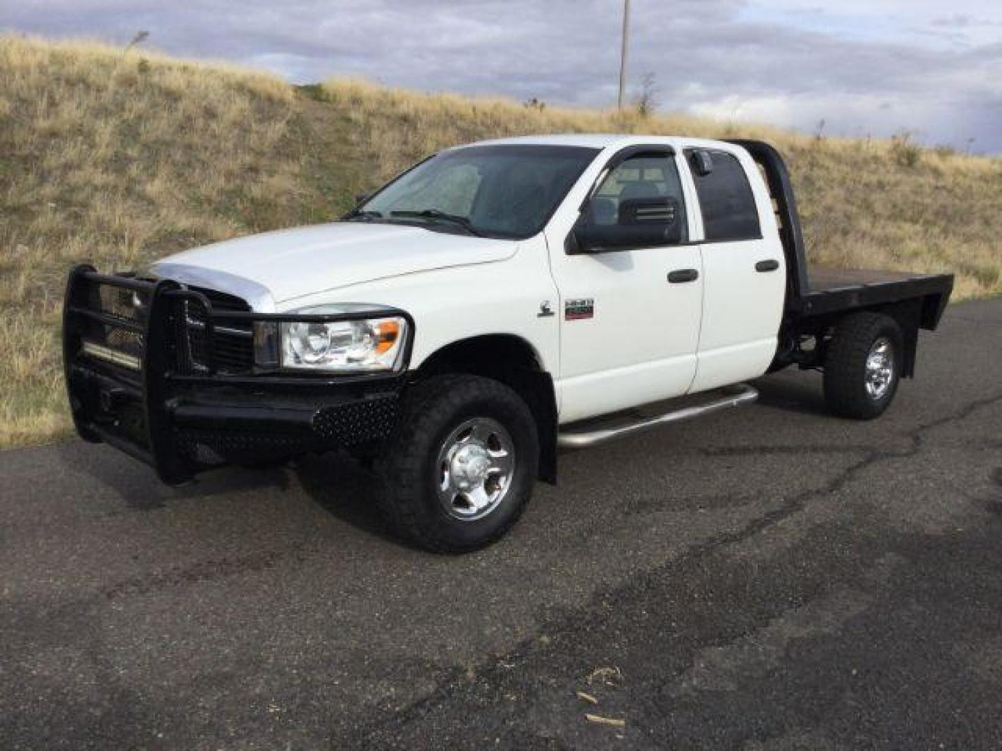 2007 Bright White /Medium Slate Gray Cloth Interior Dodge Ram 2500 SLT Quad Cab LWB 4WD (3D7KS28C37G) with an 5.9L L6 OHV 24V TURBO DIESEL engine, 6-Speed Manual transmission, located at 1801 Main Street, Lewiston, 83501, (208) 743-9371, 46.417065, -117.004799 - Photo#0