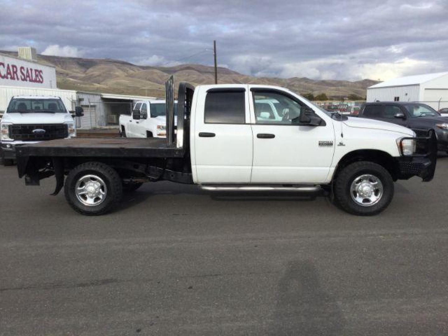 2007 Bright White /Medium Slate Gray Cloth Interior Dodge Ram 2500 SLT Quad Cab LWB 4WD (3D7KS28C37G) with an 5.9L L6 OHV 24V TURBO DIESEL engine, 6-Speed Manual transmission, located at 1801 Main Street, Lewiston, 83501, (208) 743-9371, 46.417065, -117.004799 - Photo#10