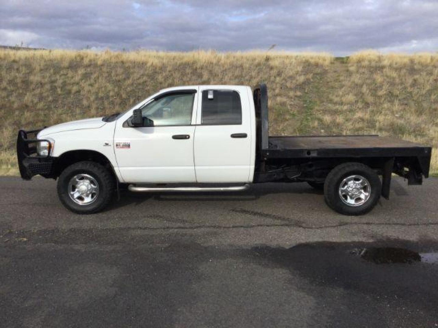 2007 Bright White /Medium Slate Gray Cloth Interior Dodge Ram 2500 SLT Quad Cab LWB 4WD (3D7KS28C37G) with an 5.9L L6 OHV 24V TURBO DIESEL engine, 6-Speed Manual transmission, located at 1801 Main Street, Lewiston, 83501, (208) 743-9371, 46.417065, -117.004799 - Photo#1