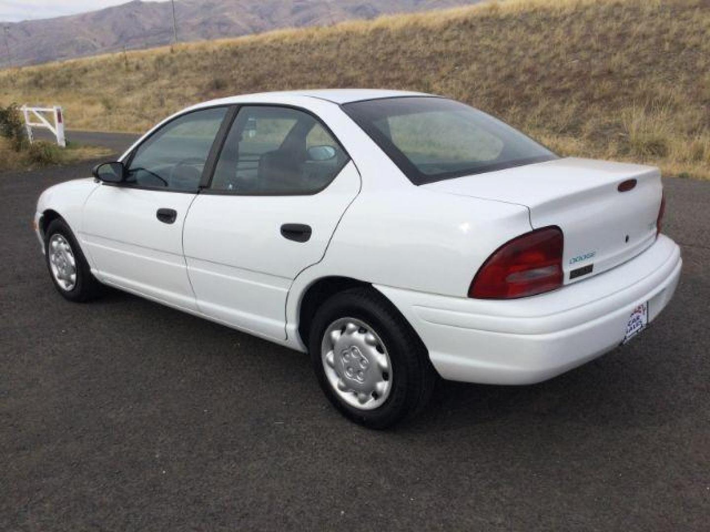 1997 White /Dark Gray Cloth Dodge Neon Sedan (1B3ES27C7VD) with an 2.0L L4 SOHC 16V engine, 3-Speed Automatic transmission, located at 1801 Main Street, Lewiston, 83501, (208) 743-9371, 46.417065, -117.004799 - Photo#2