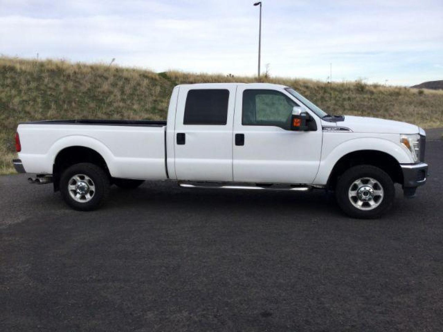 2015 Oxford White /Steel Ford F-350 SD XLT Crew Cab Long Bed 4WD (1FT8W3BT9FE) with an 6.7L V8 OHV 16V DIESEL engine, 6-Speed Automatic transmission, located at 1801 Main Street, Lewiston, 83501, (208) 743-9371, 46.417065, -117.004799 - Photo#13