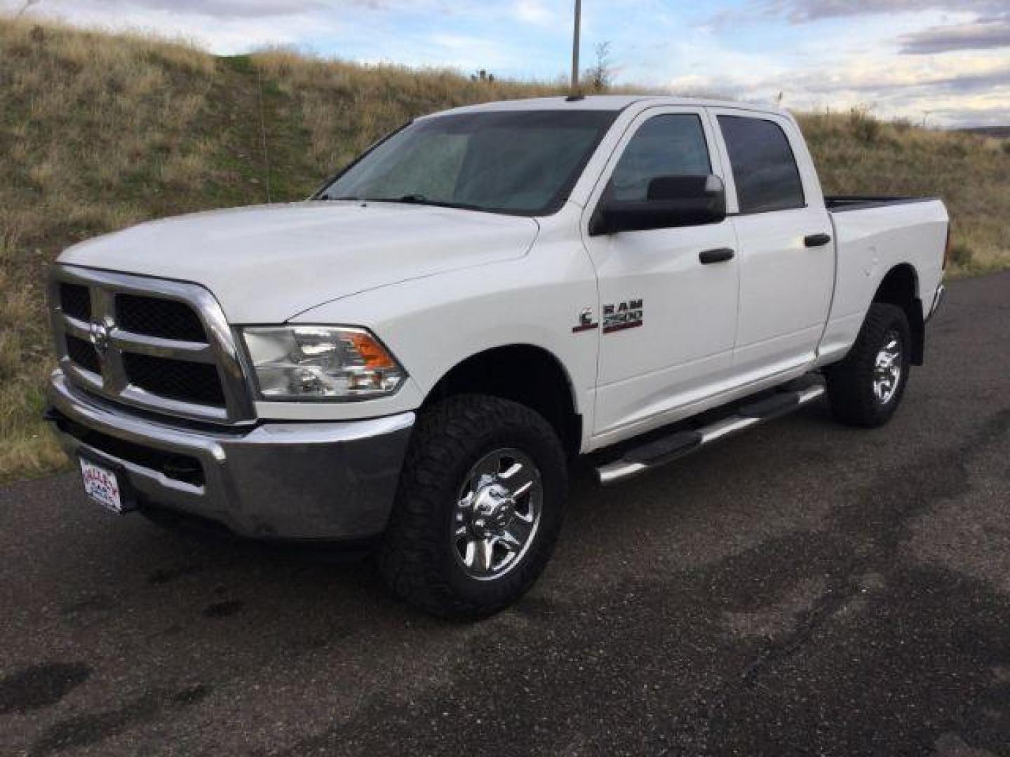 2018 Bright White Clear Coat /Black/Diesel Gray, cloth RAM 2500 Tradesman Crew Cab SWB 4WD (3C6UR5CL4JG) with an 6.7L L6 OHV 24V TURBO DIESEL engine, 6-Speed Automatic transmission, located at 1801 Main Street, Lewiston, 83501, (208) 743-9371, 46.417065, -117.004799 - Photo#0