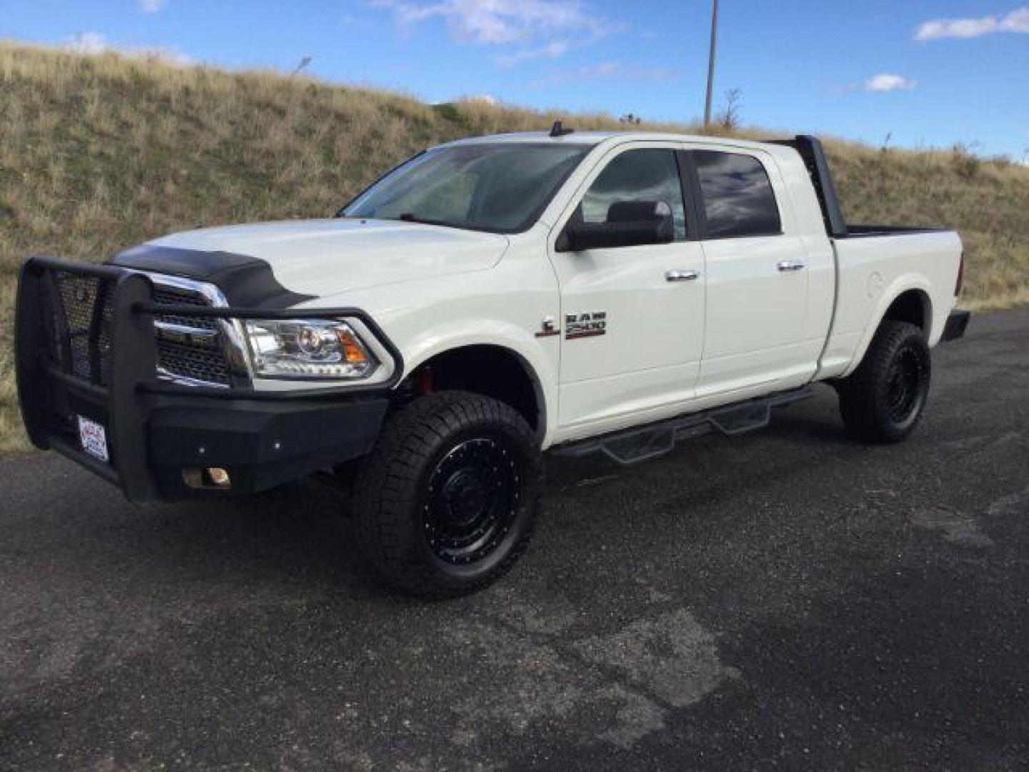 2017 Pearl White /Black, leather RAM 2500 Laramie Mega Cab 4WD (3C6UR5NL5HG) with an 6.7L L6 OHV 24V TURBO DIESEL engine, 6-Speed Automatic transmission, located at 1801 Main Street, Lewiston, 83501, (208) 743-9371, 46.417065, -117.004799 - Photo#0