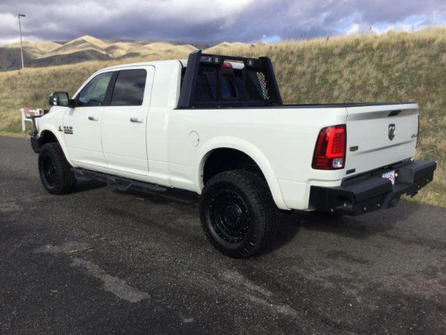 2017 Pearl White /Black, leather RAM 2500 Laramie Mega Cab 4WD (3C6UR5NL5HG) with an 6.7L L6 OHV 24V TURBO DIESEL engine, 6-Speed Automatic transmission, located at 1801 Main Street, Lewiston, 83501, (208) 743-9371, 46.417065, -117.004799 - Photo#2