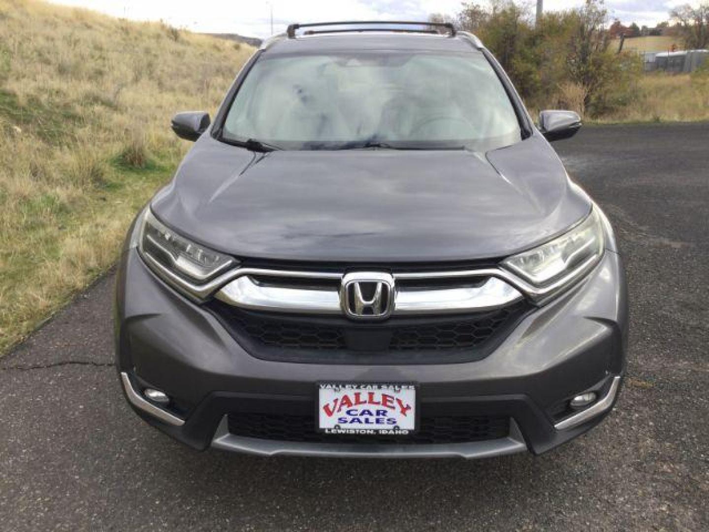 2017 Gunmetal Metallic Honda CR-V Touring AWD (2HKRW2H9XHH) with an 1.5L L4 16V DOHC TURBO engine, Continuously Variable Transmission transmission, located at 1801 Main Street, Lewiston, 83501, (208) 743-9371, 46.417065, -117.004799 - Photo#14