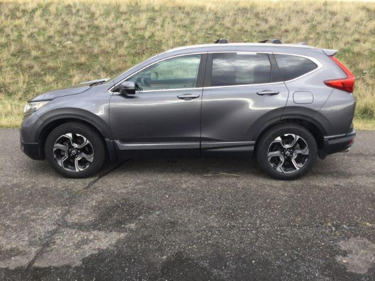 2017 Gunmetal Metallic Honda CR-V Touring AWD (2HKRW2H9XHH) with an 1.5L L4 16V DOHC TURBO engine, Continuously Variable Transmission transmission, located at 1801 Main Street, Lewiston, 83501, (208) 743-9371, 46.417065, -117.004799 - Photo#1