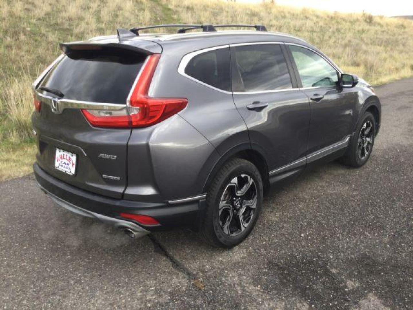 2017 Gunmetal Metallic Honda CR-V Touring AWD (2HKRW2H9XHH) with an 1.5L L4 16V DOHC TURBO engine, Continuously Variable Transmission transmission, located at 1801 Main Street, Lewiston, 83501, (208) 743-9371, 46.417065, -117.004799 - Photo#23