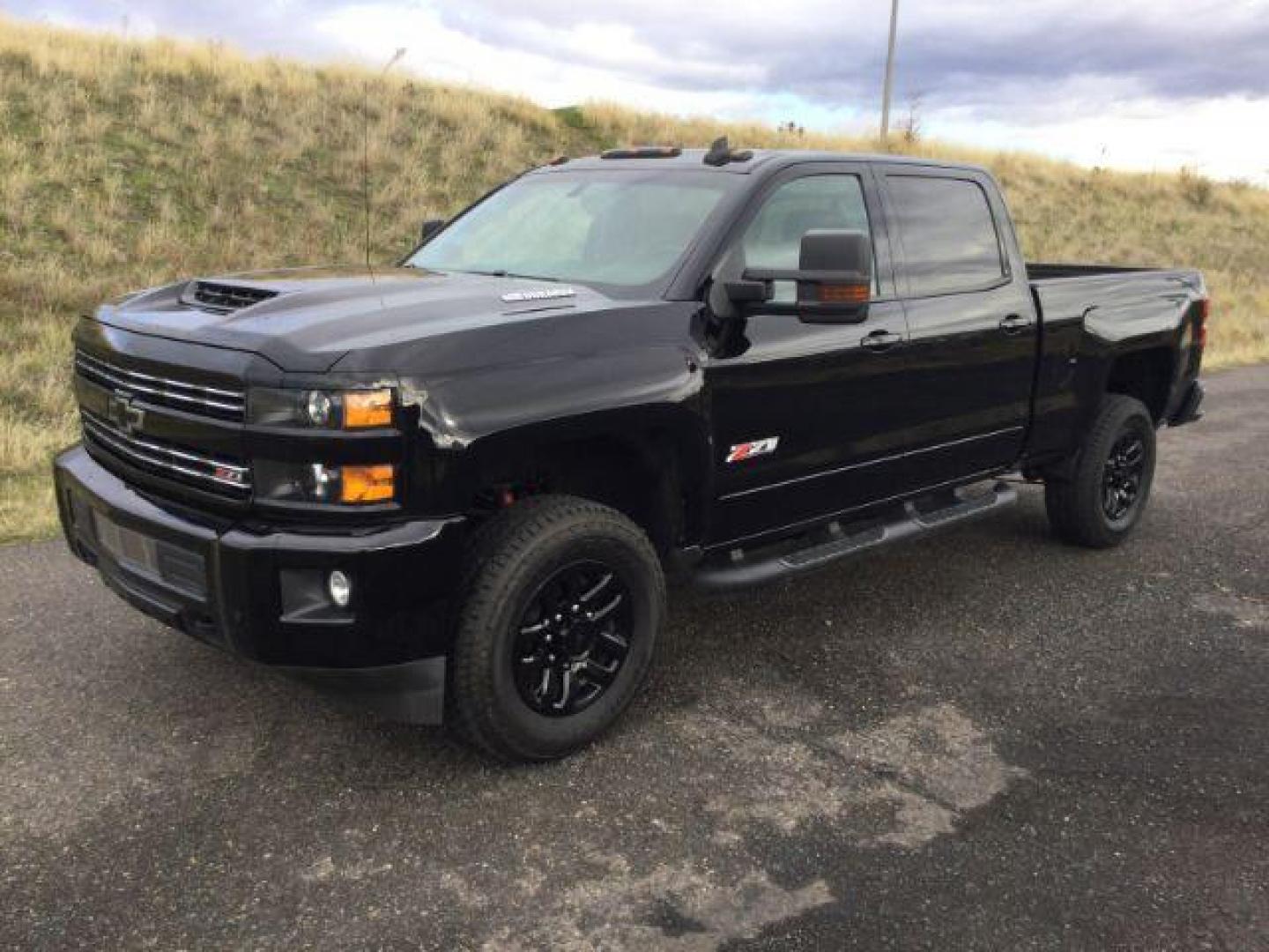 2019 Black /Jet Black, leather Chevrolet Silverado 2500HD LT Crew Cab Short Box 4WD (1GC1KSEY8KF) with an 6.6L V8 OHV 16V DIESEL engine, 6-Speed Automatic transmission, located at 1801 Main Street, Lewiston, 83501, (208) 743-9371, 46.417065, -117.004799 - Photo#0