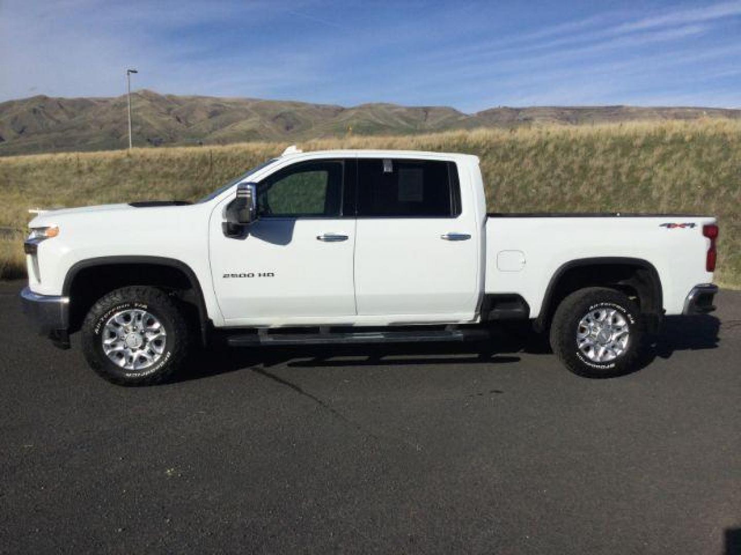 2020 Summit White Chevrolet Silverado 2500HD LTZ Crew Cab Short Box 4WD (1GC4YPE77LF) with an 6.6L V8 OHV 16V engine, 6-Speed Automatic transmission, located at 1801 Main Street, Lewiston, 83501, (208) 743-9371, 46.417065, -117.004799 - Photo#1