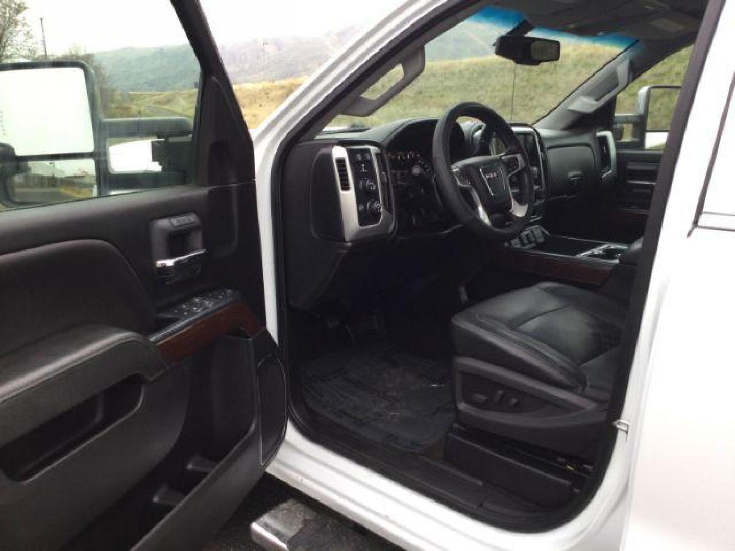 2018 Summit White /Jet Black, leather GMC Sierra 3500HD SLT Crew Cab 4WD (1GT42XCG2JF) with an 6.0L V8 OHV 16V FFV engine, 6-Speed Automatic transmission, located at 1801 Main Street, Lewiston, 83501, (208) 743-9371, 46.417065, -117.004799 - Photo#3