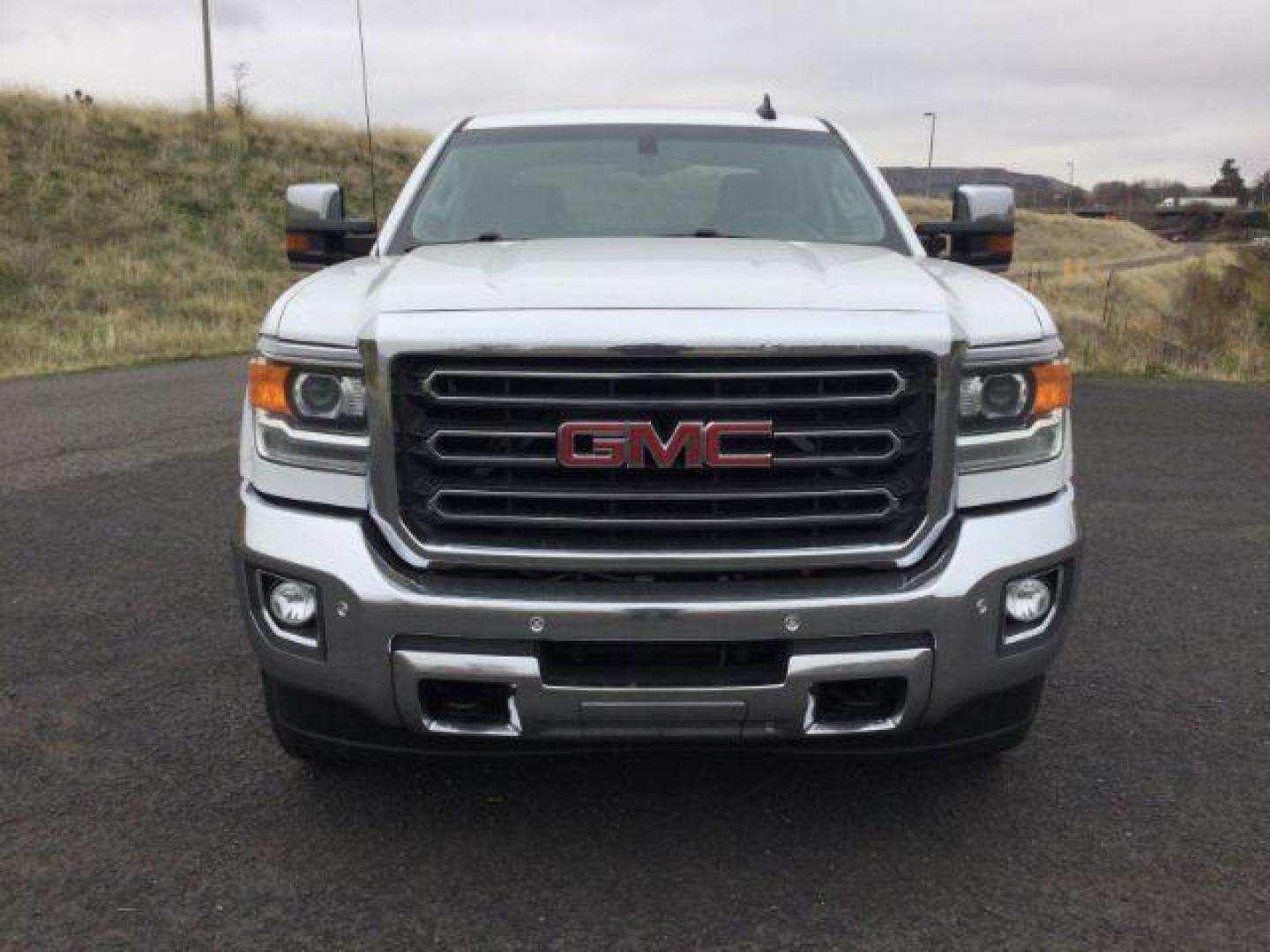 2018 Summit White /Jet Black, leather GMC Sierra 3500HD SLT Crew Cab 4WD (1GT42XCG2JF) with an 6.0L V8 OHV 16V FFV engine, 6-Speed Automatic transmission, located at 1801 Main Street, Lewiston, 83501, (208) 743-9371, 46.417065, -117.004799 - Photo#7