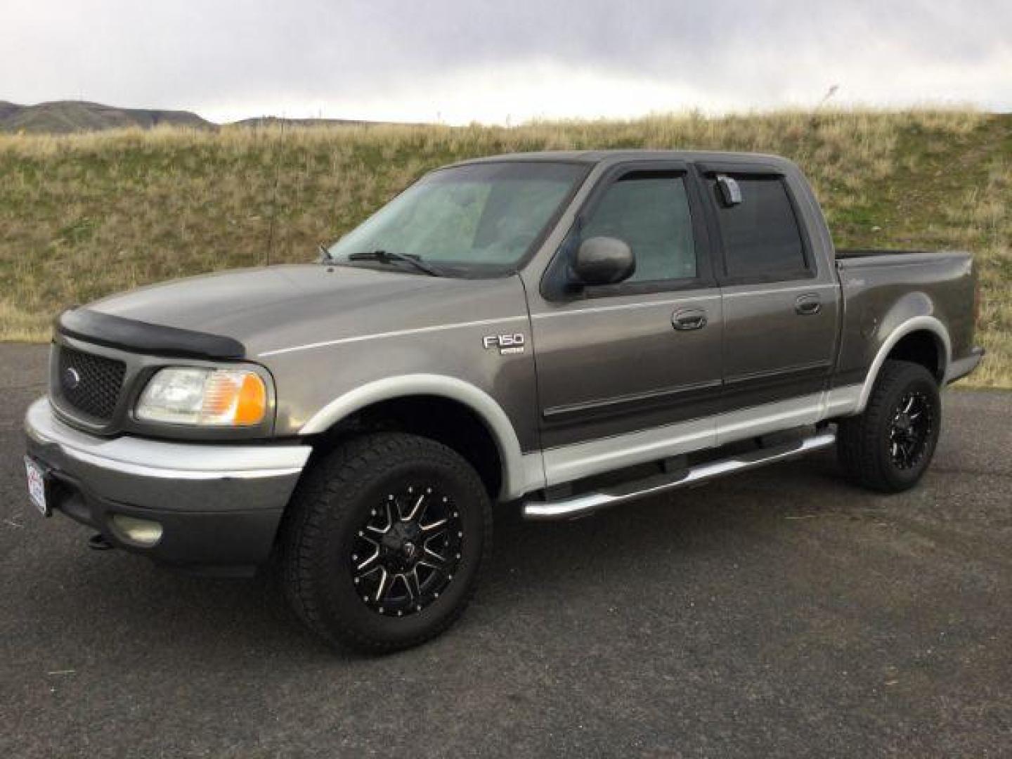 2002 Dark Shadow Gray Metallic/Silver Metallic /light gray leather Ford F-150 Lariat SuperCrew Short Bed 4WD (1FTRW08L32K) with an 5.4L V8 SOHC 16V engine, 4-Speed Automatic transmission, located at 1801 Main Street, Lewiston, 83501, (208) 743-9371, 46.417065, -117.004799 - Photo#0