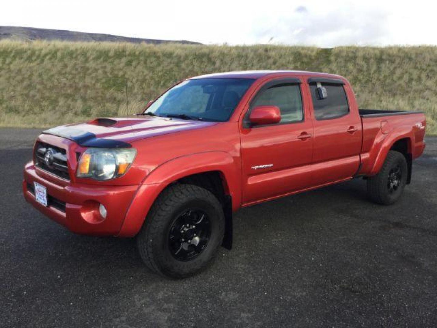 2009 Barcelona Red Metallic /Graphite Cloth Interior Toyota Tacoma Double Cab Long Bed V6 Auto 4WD (5TEMU52N89Z) with an 4.0L V6 DOHC 24V engine, 5-Speed Automatic transmission, located at 1801 Main Street, Lewiston, 83501, (208) 743-9371, 46.417065, -117.004799 - Photo#0