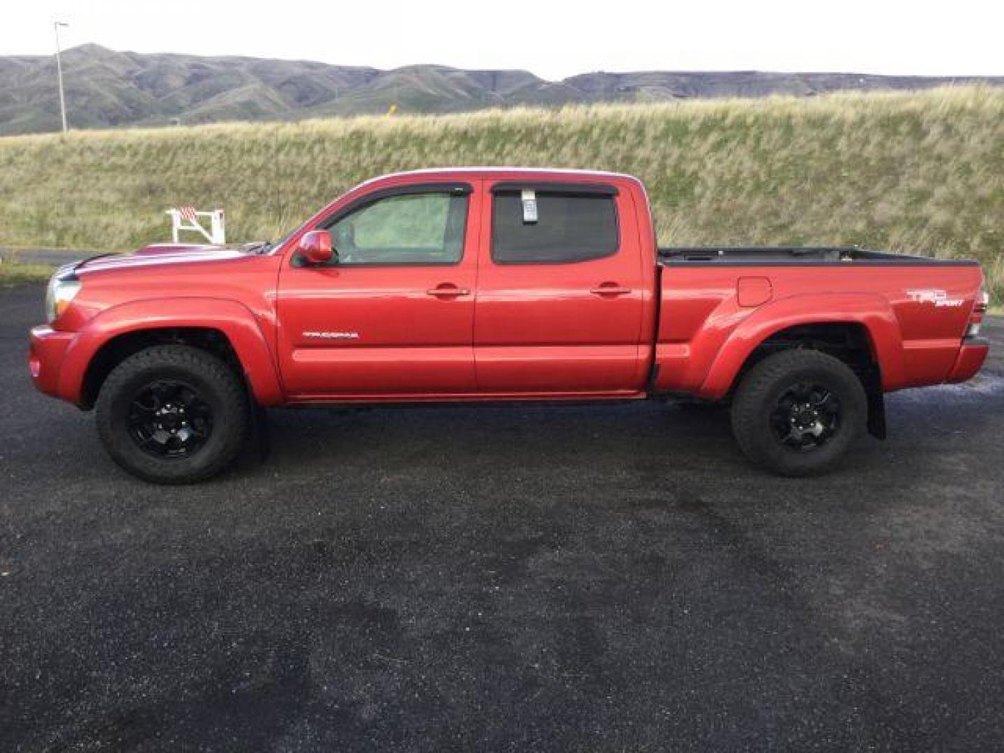 2009 Barcelona Red Metallic /Graphite Cloth Interior Toyota Tacoma Double Cab Long Bed V6 Auto 4WD (5TEMU52N89Z) with an 4.0L V6 DOHC 24V engine, 5-Speed Automatic transmission, located at 1801 Main Street, Lewiston, 83501, (208) 743-9371, 46.417065, -117.004799 - Photo#1