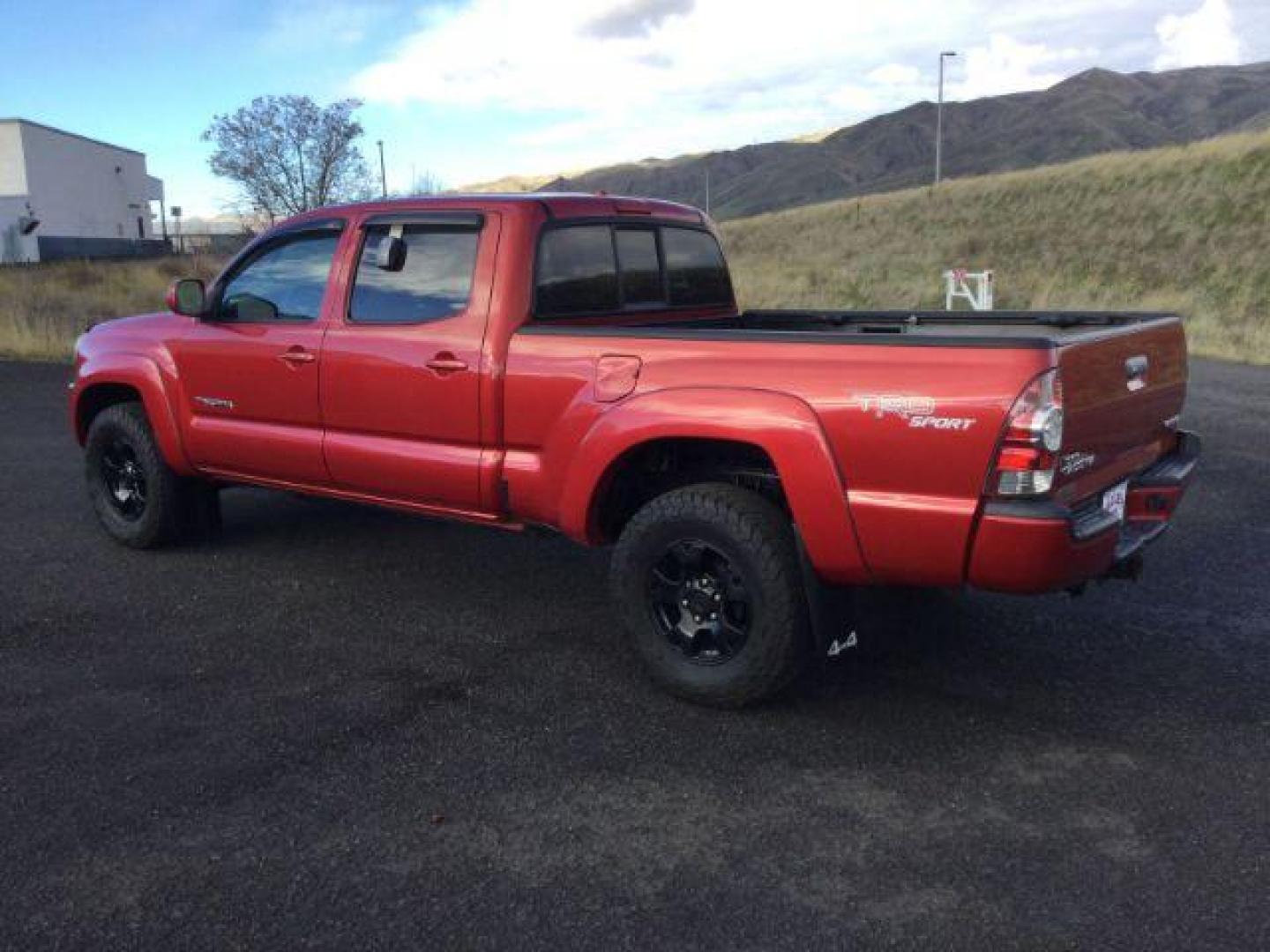 2009 Barcelona Red Metallic /Graphite Cloth Interior Toyota Tacoma Double Cab Long Bed V6 Auto 4WD (5TEMU52N89Z) with an 4.0L V6 DOHC 24V engine, 5-Speed Automatic transmission, located at 1801 Main Street, Lewiston, 83501, (208) 743-9371, 46.417065, -117.004799 - Photo#2