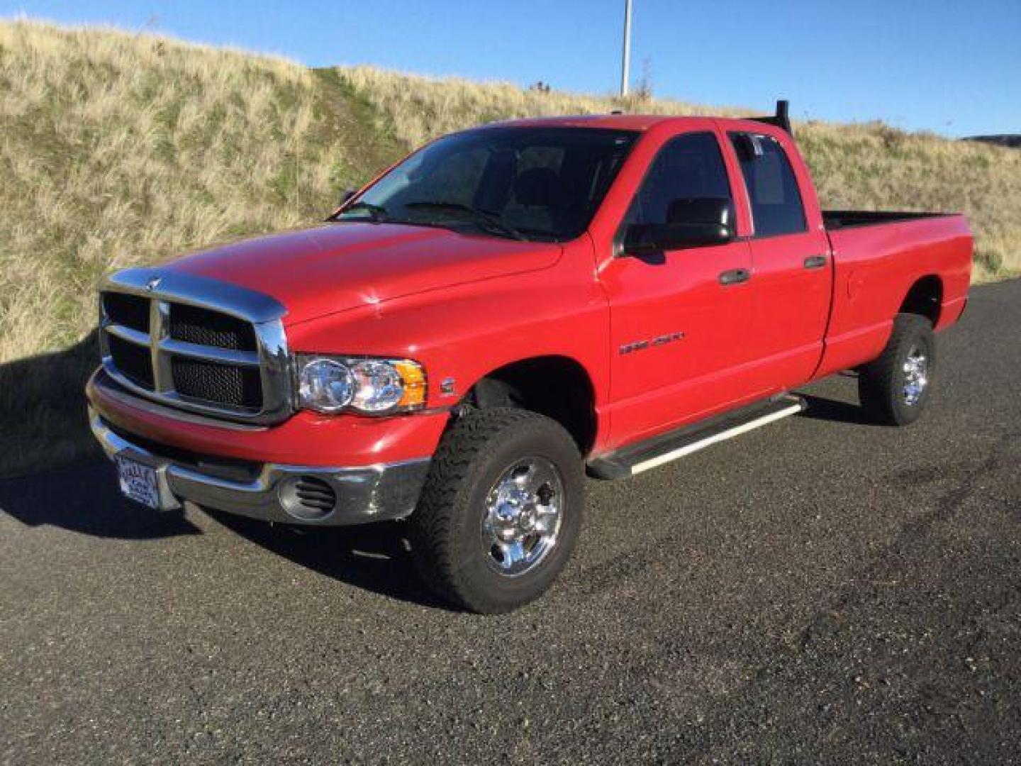 2004 Flame Red /Dark Slate Gray Cloth Interior Dodge Ram 2500 SLT Quad Cab Long Bed 4WD (3D7KU28C84G) with an 5.9L L6 OHV 24V TURBO DIESEL engine, 4-Speed Automatic transmission, located at 1801 Main Street, Lewiston, 83501, (208) 743-9371, 46.417065, -117.004799 - Photo#0