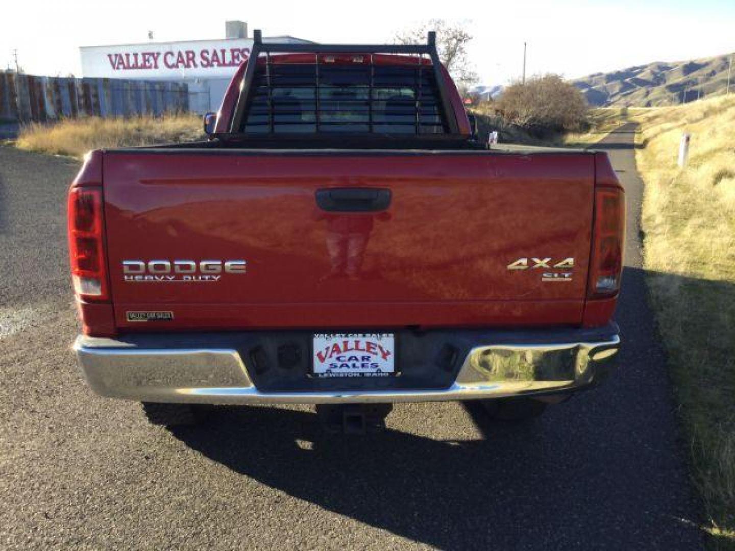 2004 Flame Red /Dark Slate Gray Cloth Interior Dodge Ram 2500 SLT Quad Cab Long Bed 4WD (3D7KU28C84G) with an 5.9L L6 OHV 24V TURBO DIESEL engine, 4-Speed Automatic transmission, located at 1801 Main Street, Lewiston, 83501, (208) 743-9371, 46.417065, -117.004799 - Photo#12