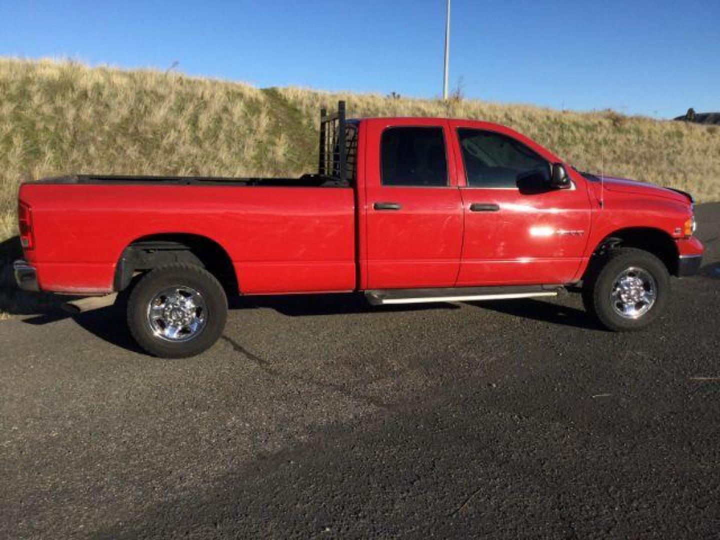 2004 Flame Red /Dark Slate Gray Cloth Interior Dodge Ram 2500 SLT Quad Cab Long Bed 4WD (3D7KU28C84G) with an 5.9L L6 OHV 24V TURBO DIESEL engine, 4-Speed Automatic transmission, located at 1801 Main Street, Lewiston, 83501, (208) 743-9371, 46.417065, -117.004799 - Photo#14