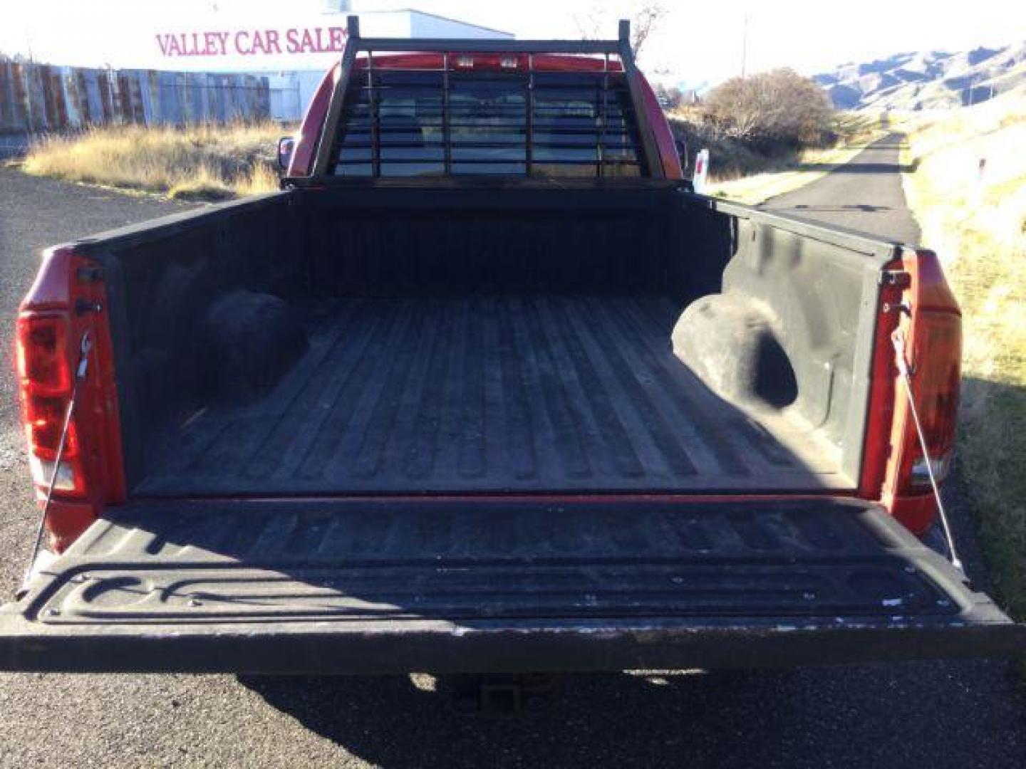 2004 Flame Red /Dark Slate Gray Cloth Interior Dodge Ram 2500 SLT Quad Cab Long Bed 4WD (3D7KU28C84G) with an 5.9L L6 OHV 24V TURBO DIESEL engine, 4-Speed Automatic transmission, located at 1801 Main Street, Lewiston, 83501, (208) 743-9371, 46.417065, -117.004799 - Photo#16