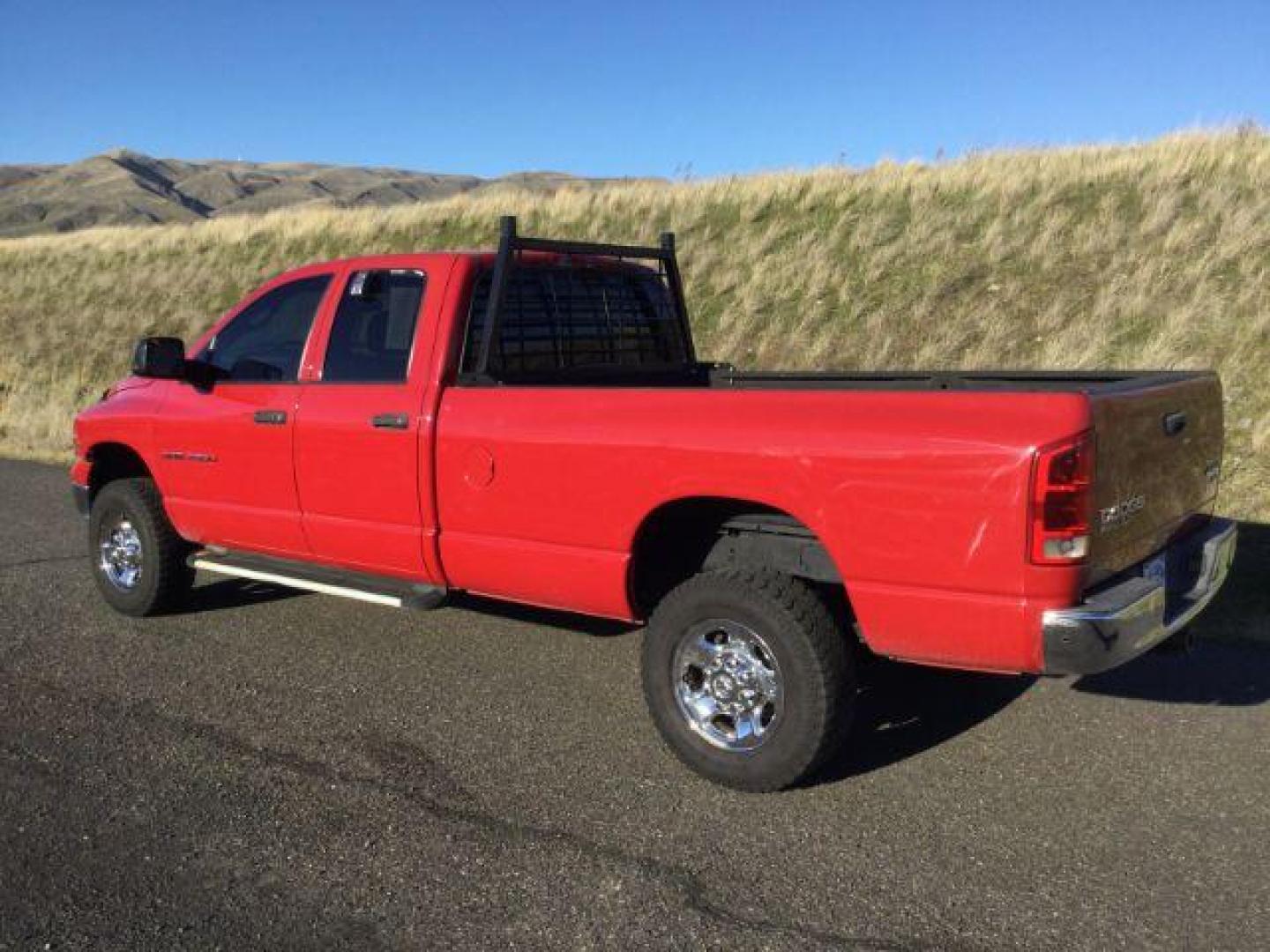 2004 Flame Red /Dark Slate Gray Cloth Interior Dodge Ram 2500 SLT Quad Cab Long Bed 4WD (3D7KU28C84G) with an 5.9L L6 OHV 24V TURBO DIESEL engine, 4-Speed Automatic transmission, located at 1801 Main Street, Lewiston, 83501, (208) 743-9371, 46.417065, -117.004799 - Photo#2